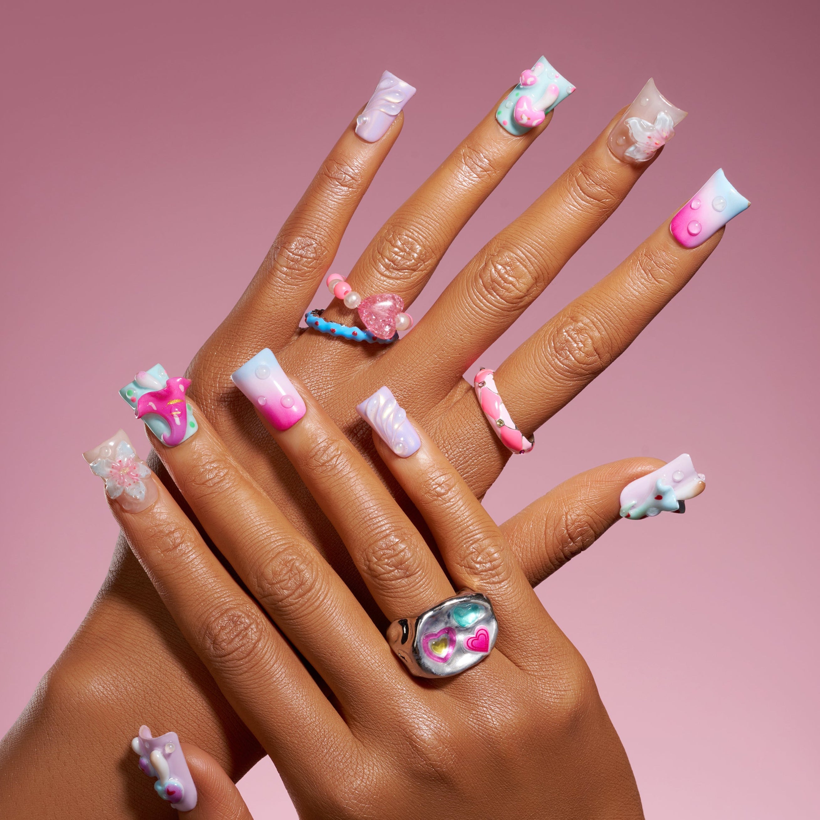 Pastel fantasy press on nails with 3D mushrooms, floral details, and dreamy gradient nail art.