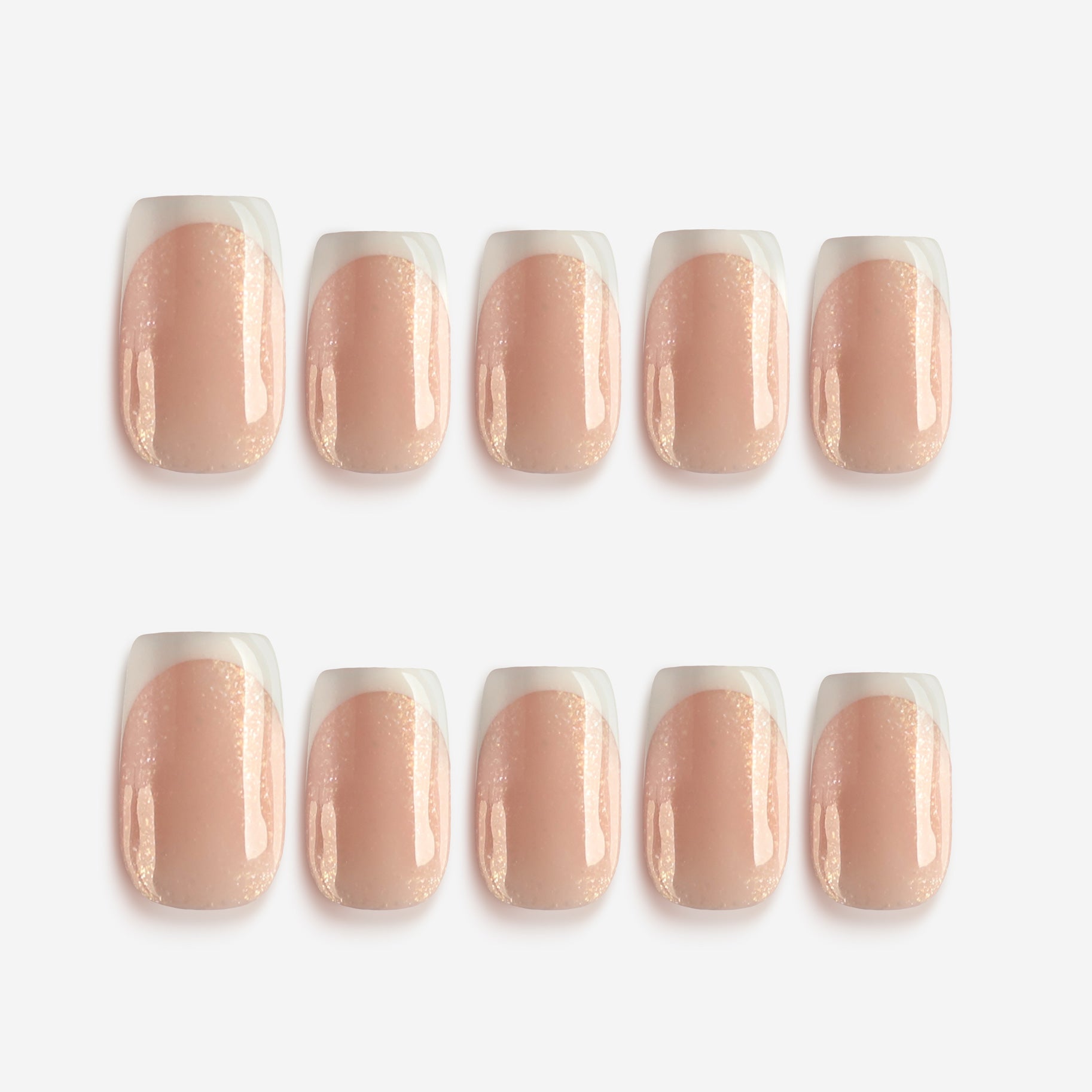 Short square nude press on nails with glossy finish and soft natural tone.