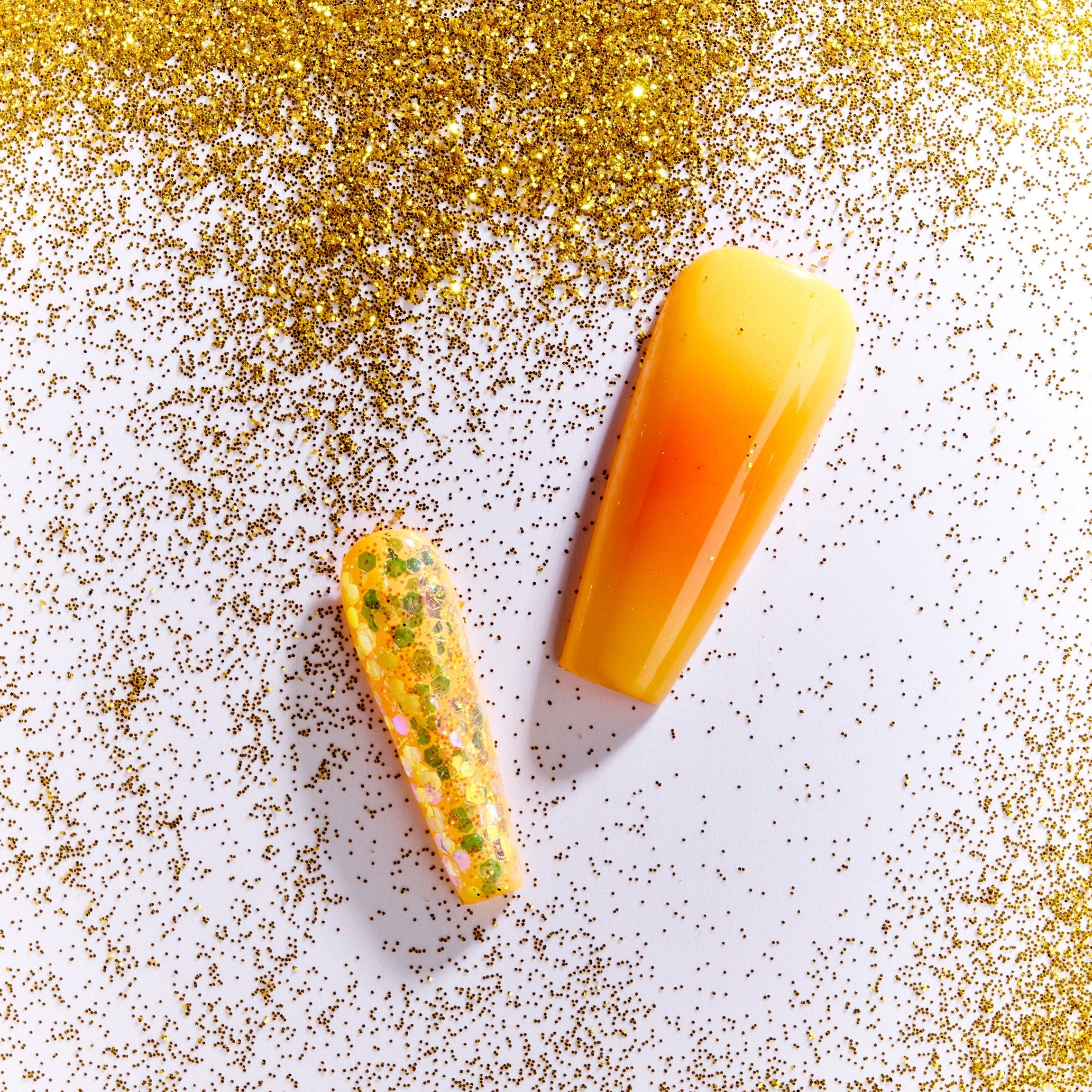 Warm amber gradient press on nails inspired by sunset tones. Glossy, elegant and reusable.