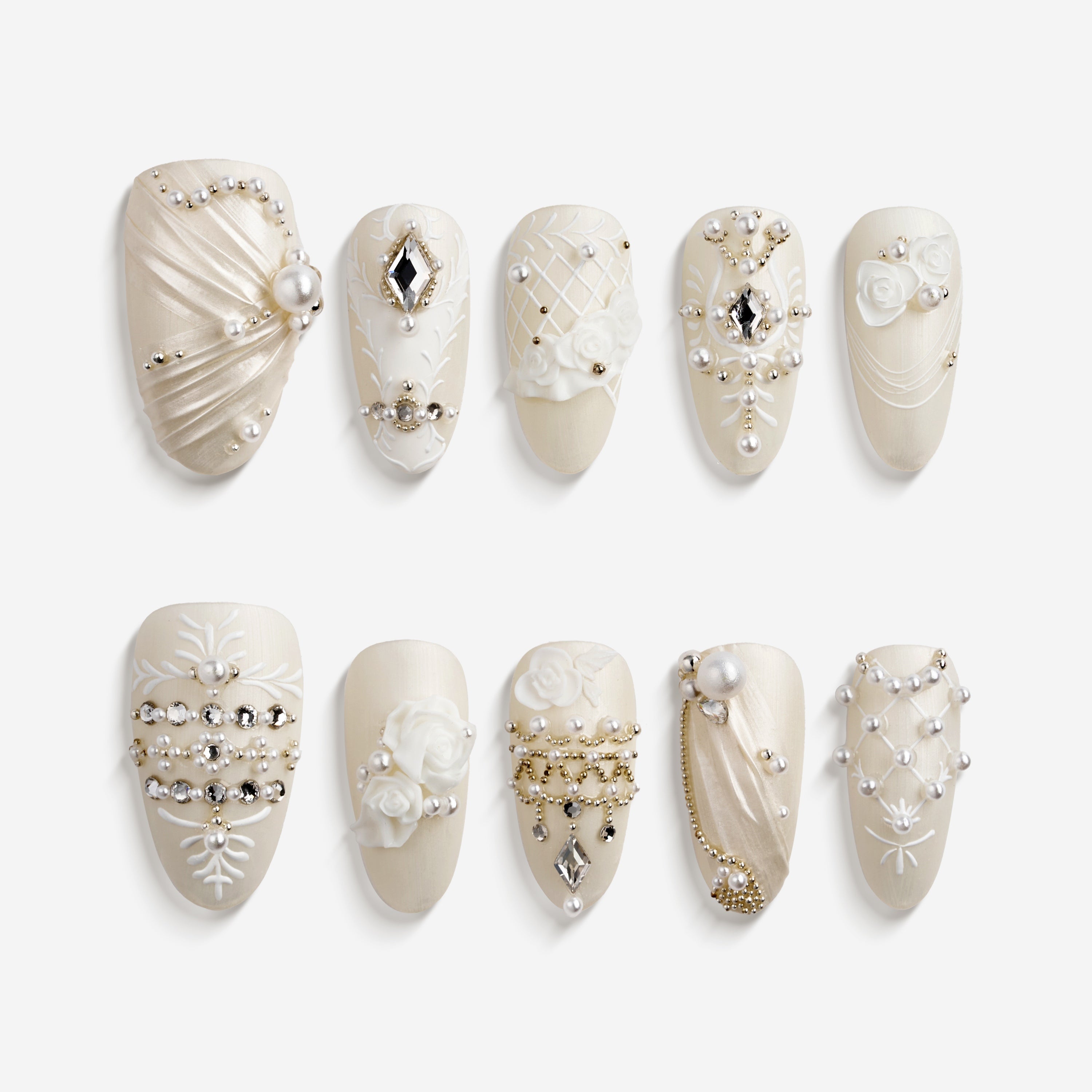 Luxury ivory wedding press on nails with pearl and crystal embellishments by BOXNAIL. Elegant cathedral-inspired bridal manicure set.