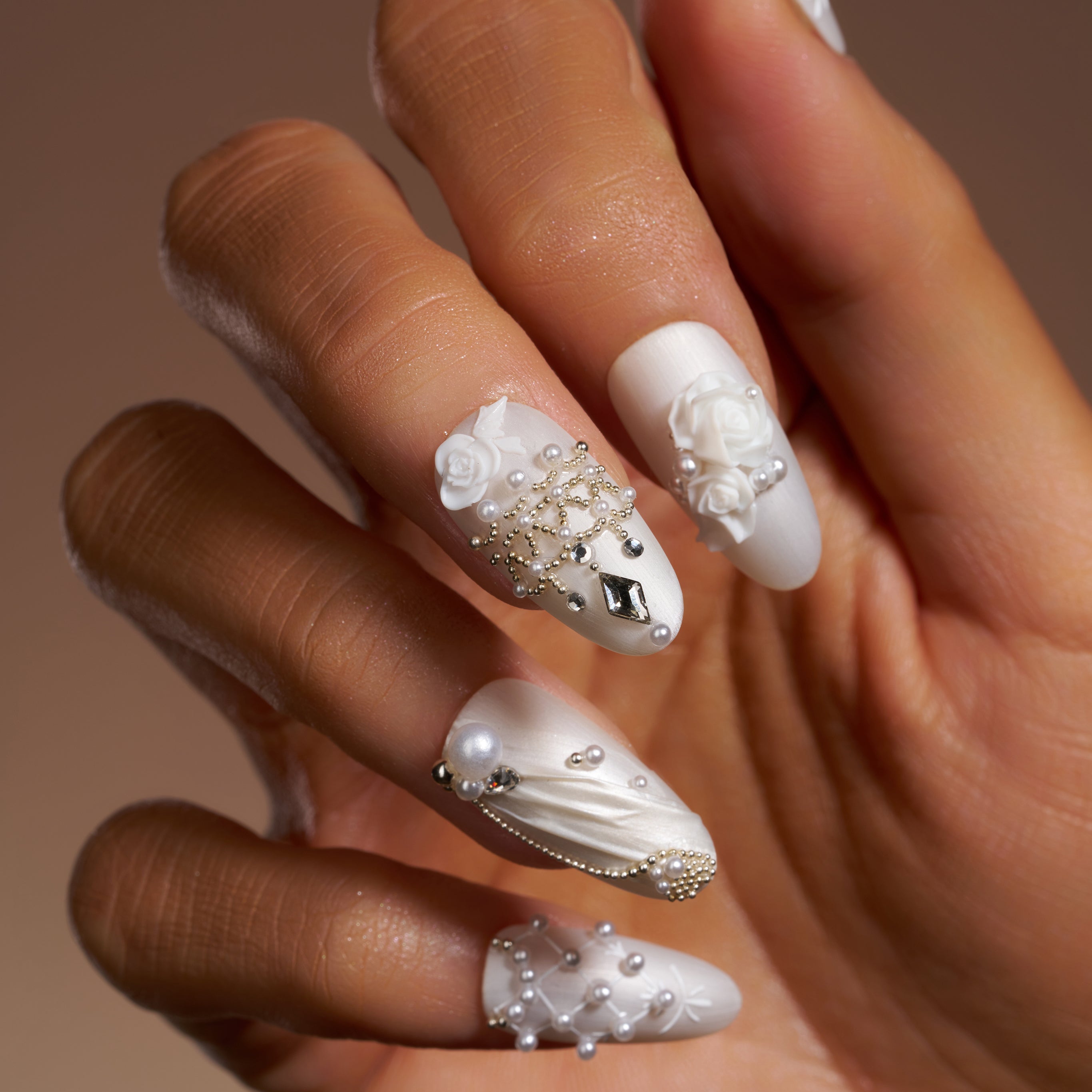 Luxury ivory wedding press on nails with pearl and crystal embellishments by BOXNAIL. Elegant cathedral-inspired bridal manicure set.