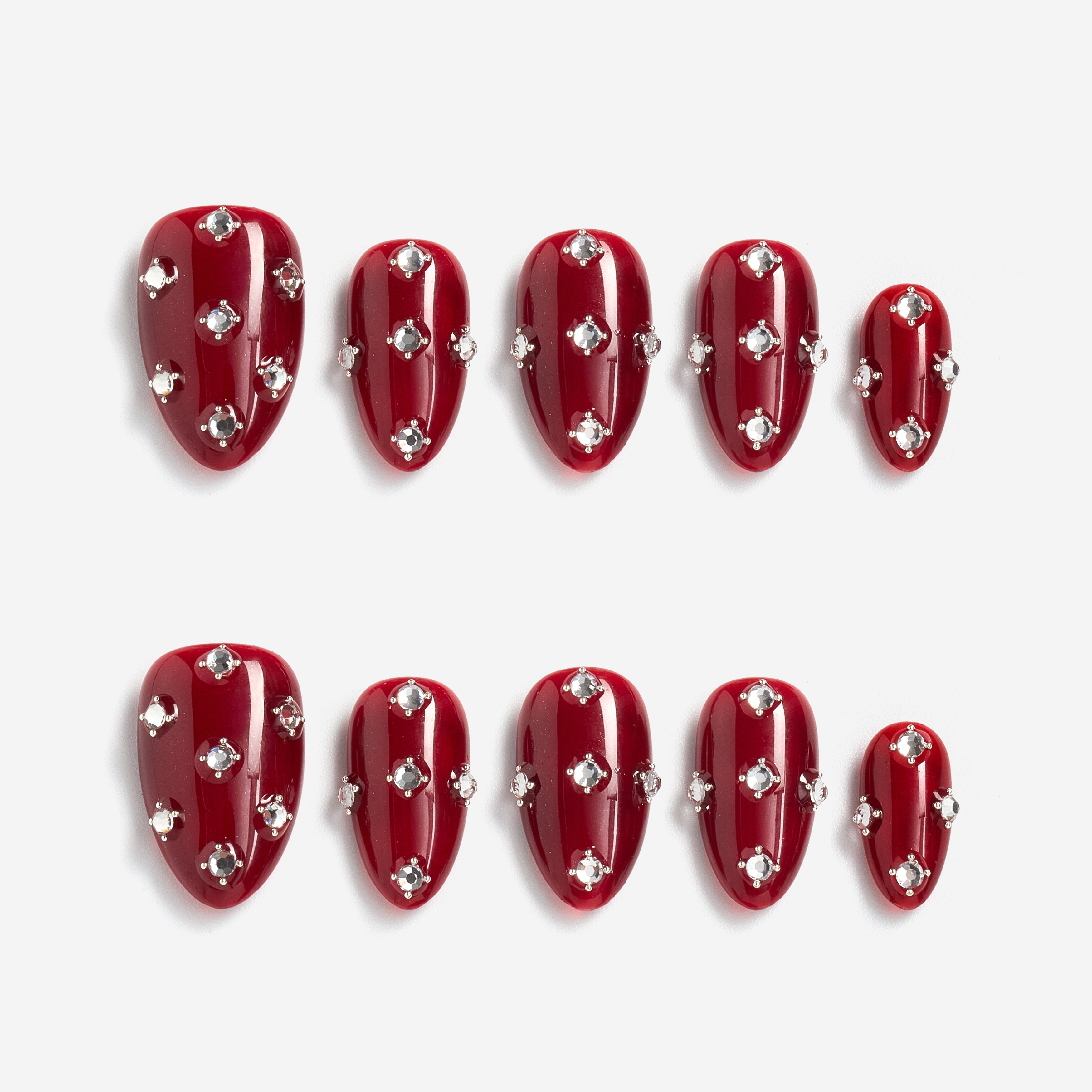 Short burgundy press on nails with crystal detailing. Reusable elegant nail art set.