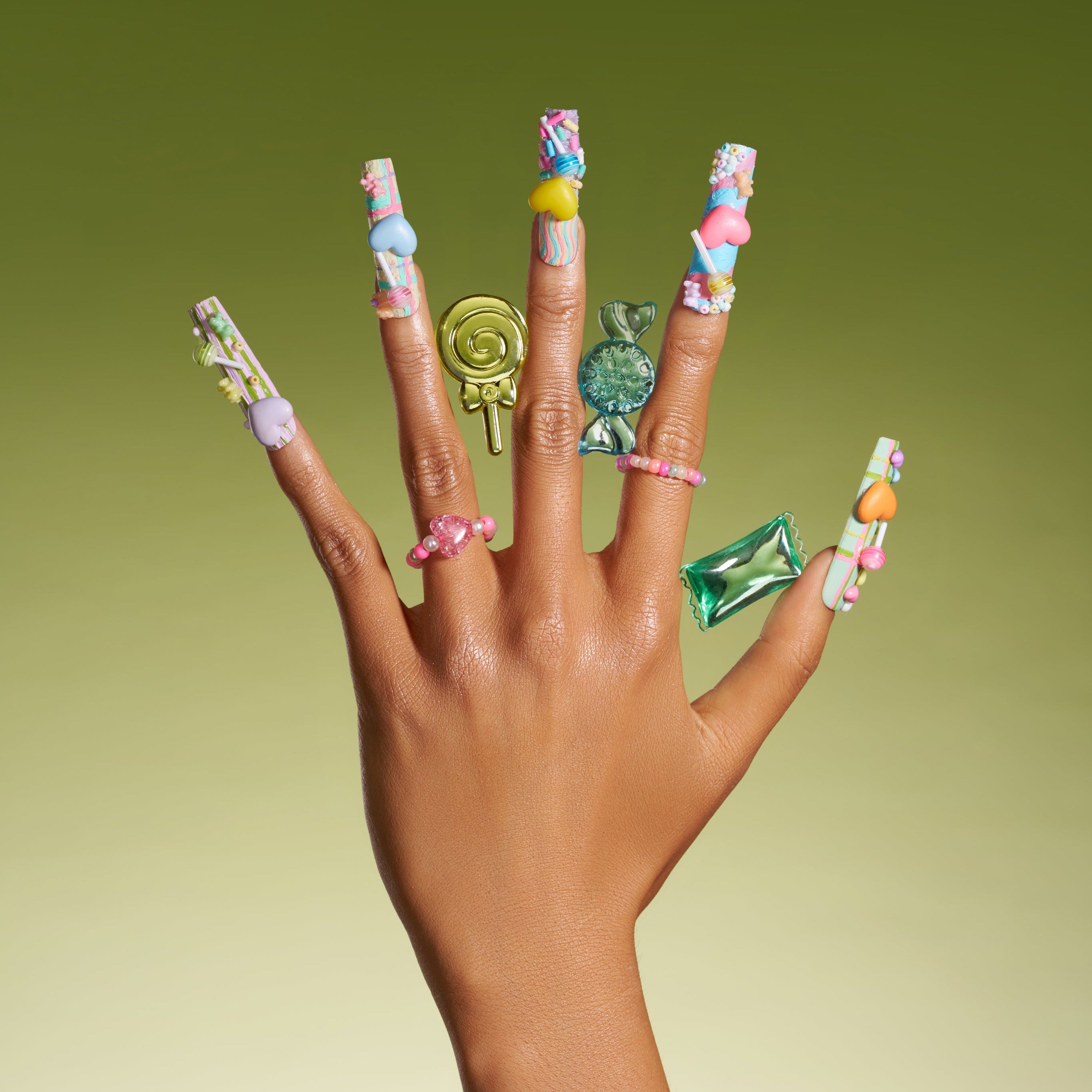 Playful 3D candy heart press on nails in pastel tones. Reusable Y2K-inspired nail art set.