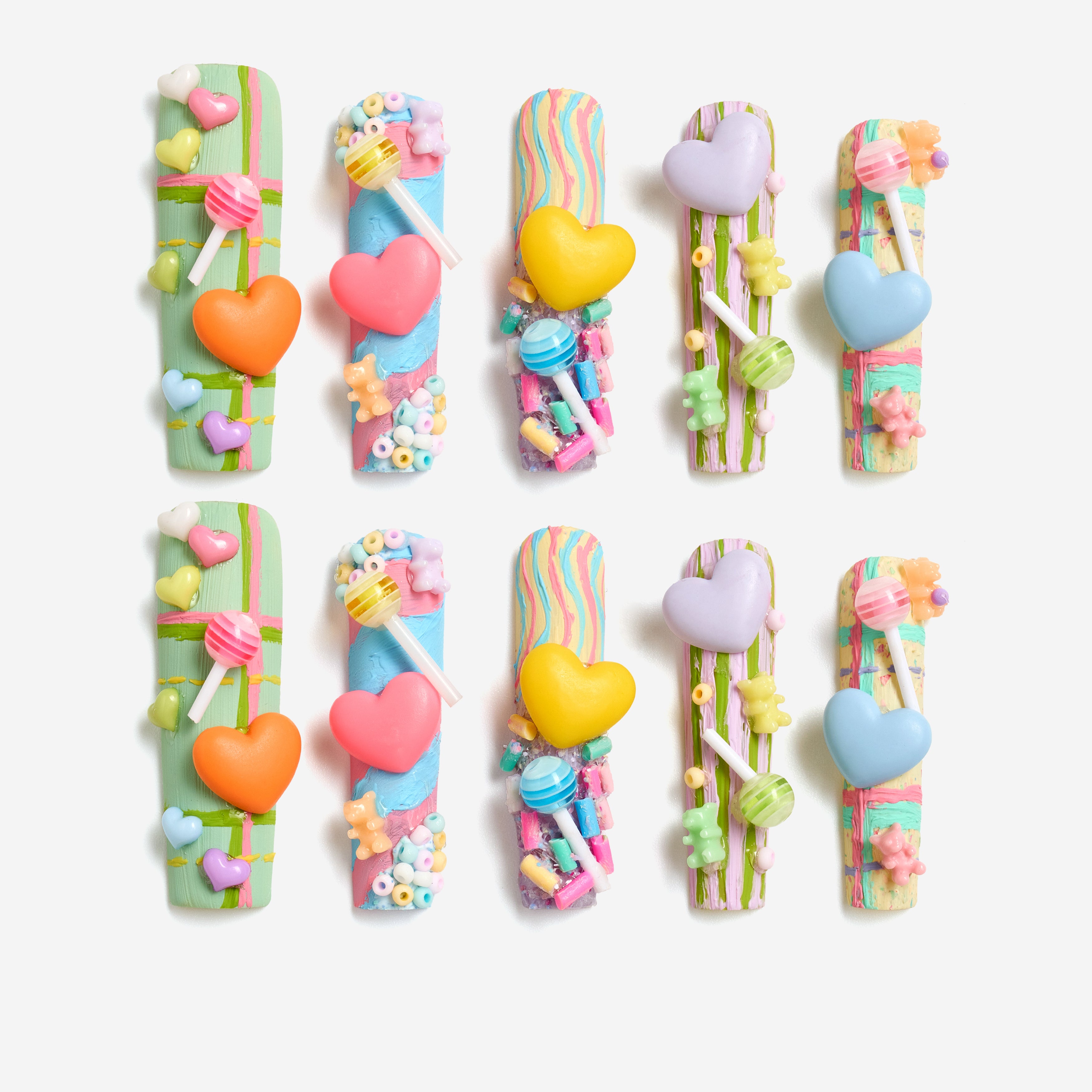 Playful 3D candy heart press on nails in pastel tones. Reusable Y2K-inspired nail art set.