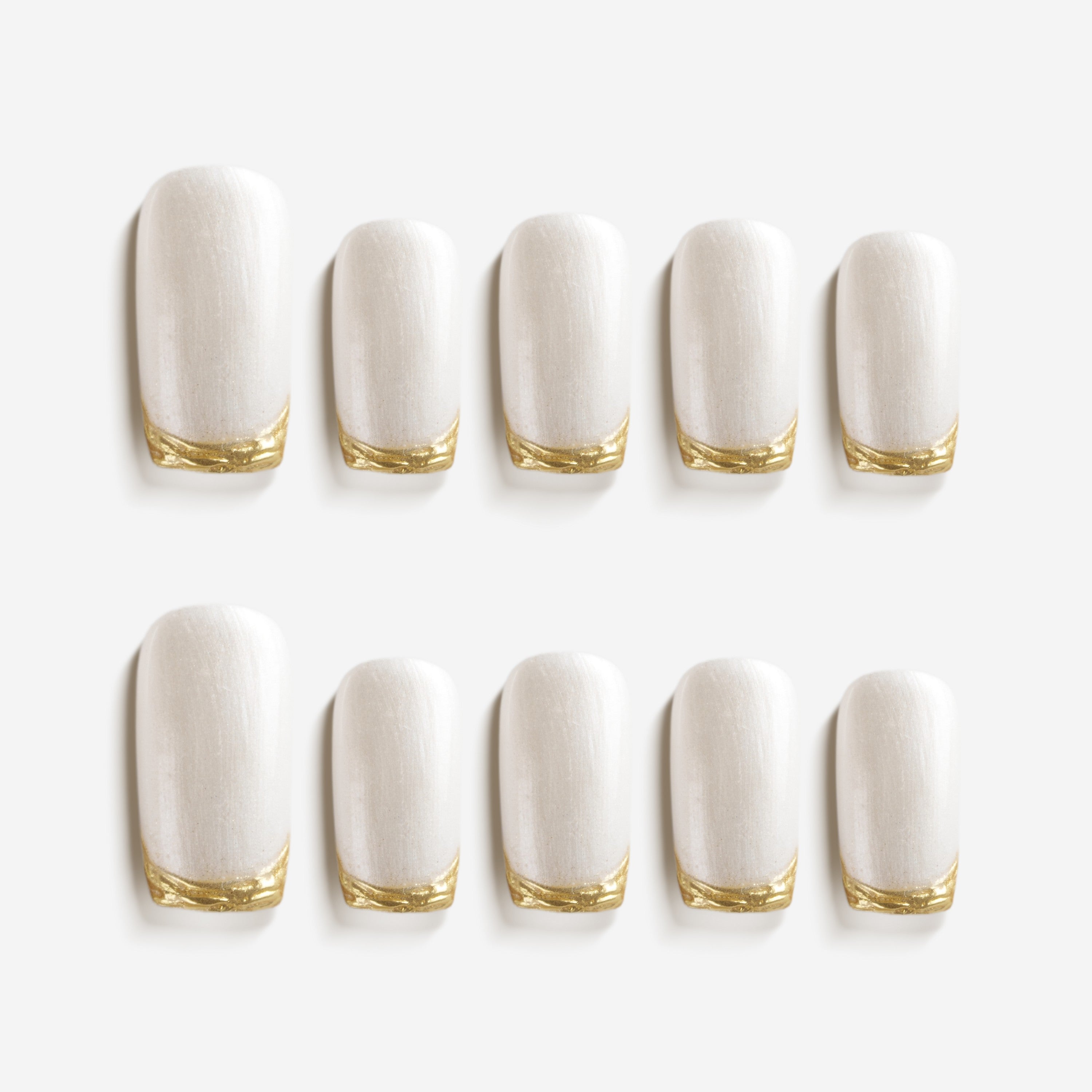 Champagne Fine Gold press on nails with soft shimmer and gold accent. Elegant bridal ready false nails.