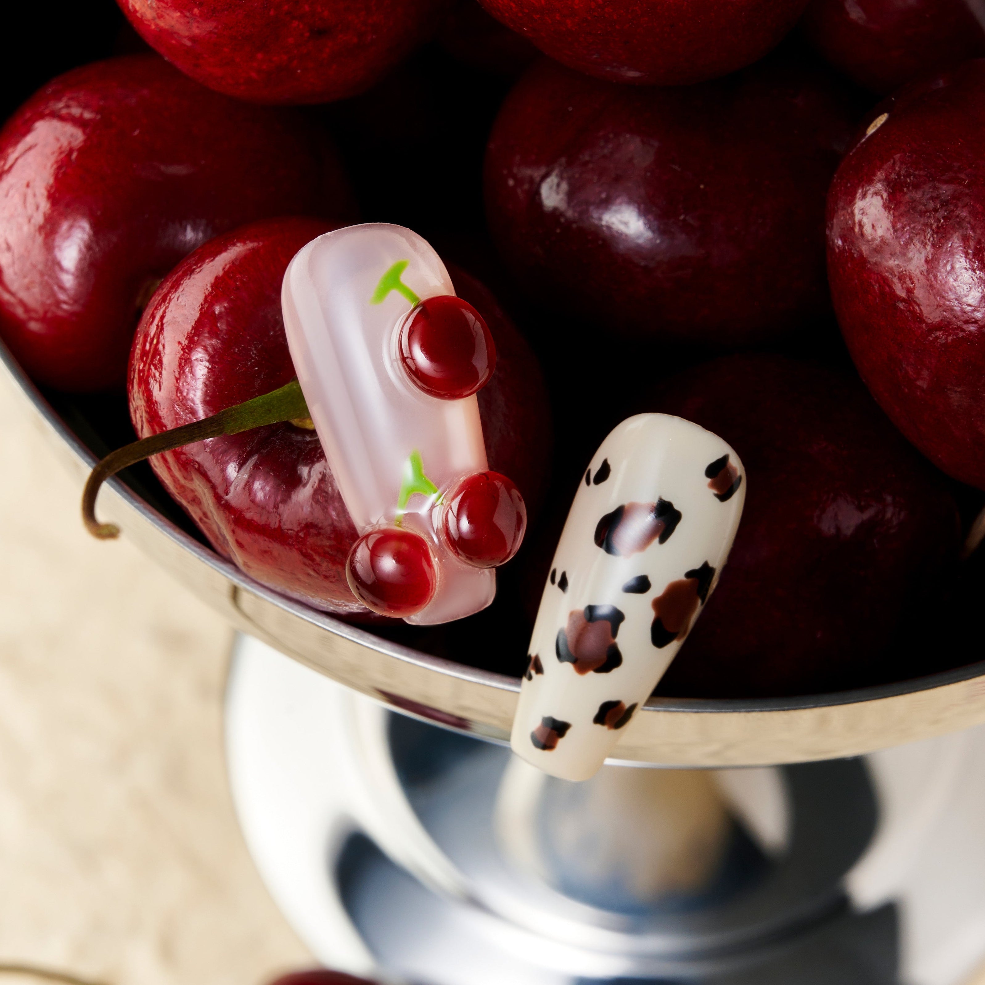 Coffin press on nails with cherry art and brown leopard print on nude and pink base