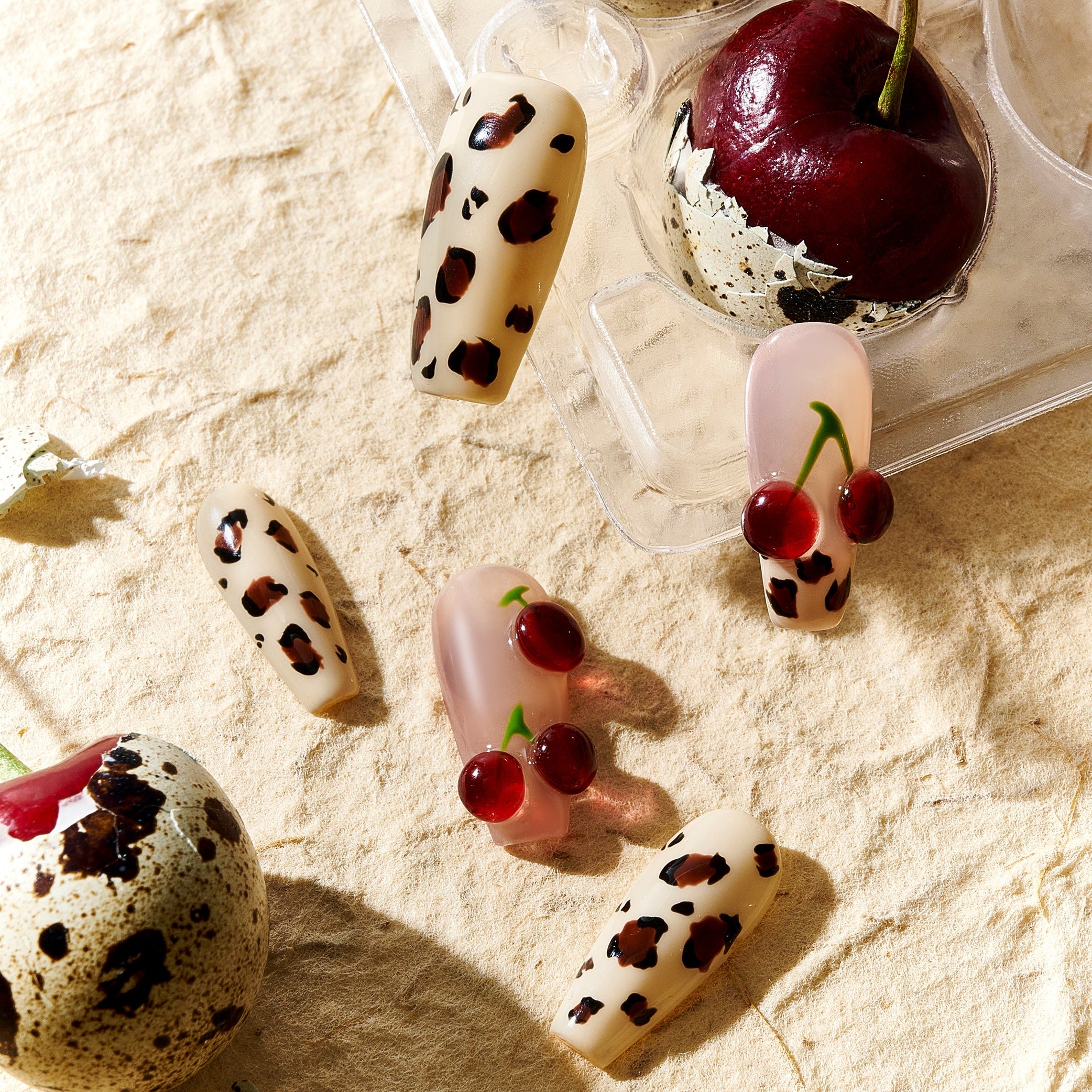 Coffin press on nails with cherry art and brown leopard print on nude and pink base