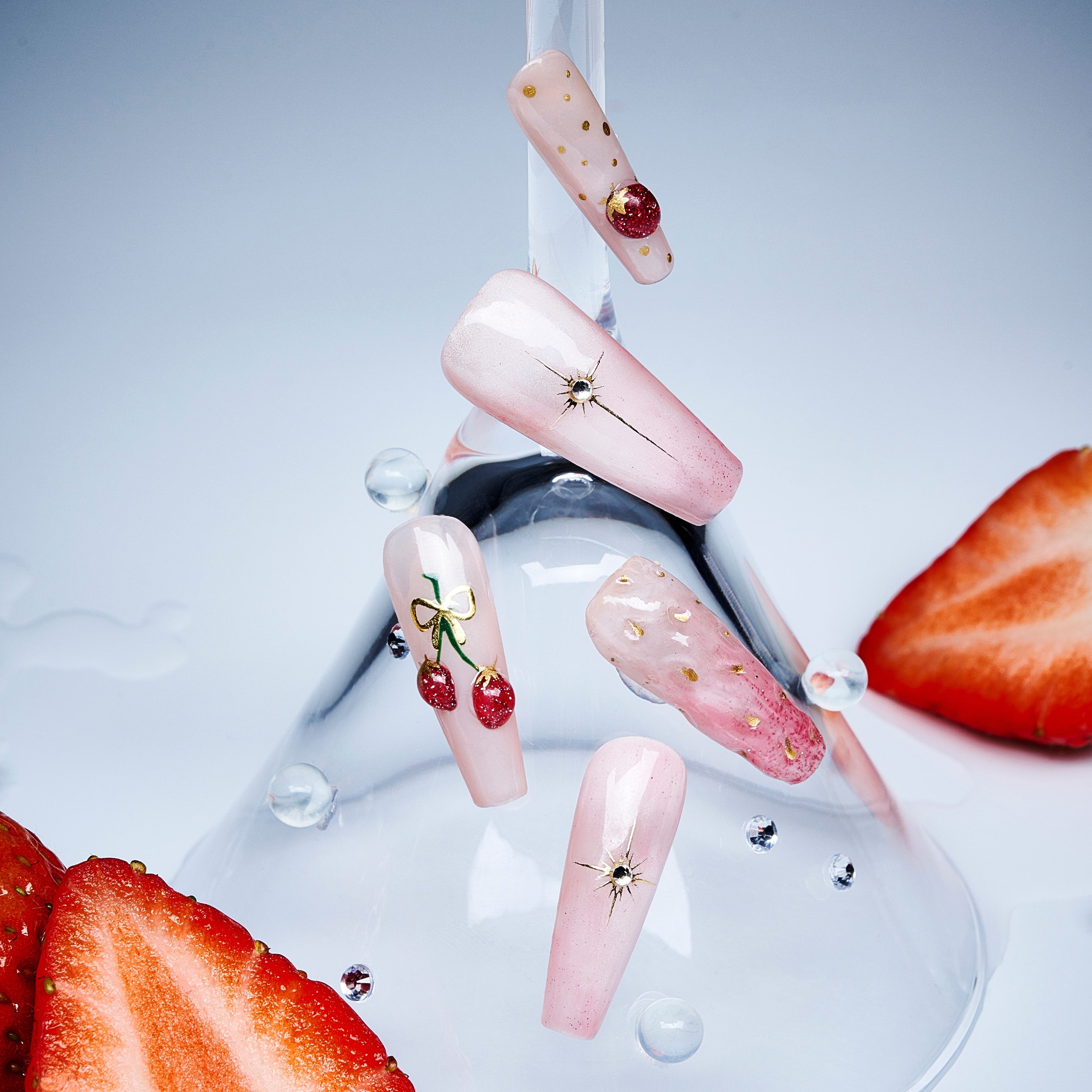 Cherry Glow nude press on nails with cherry accents and glossy finish