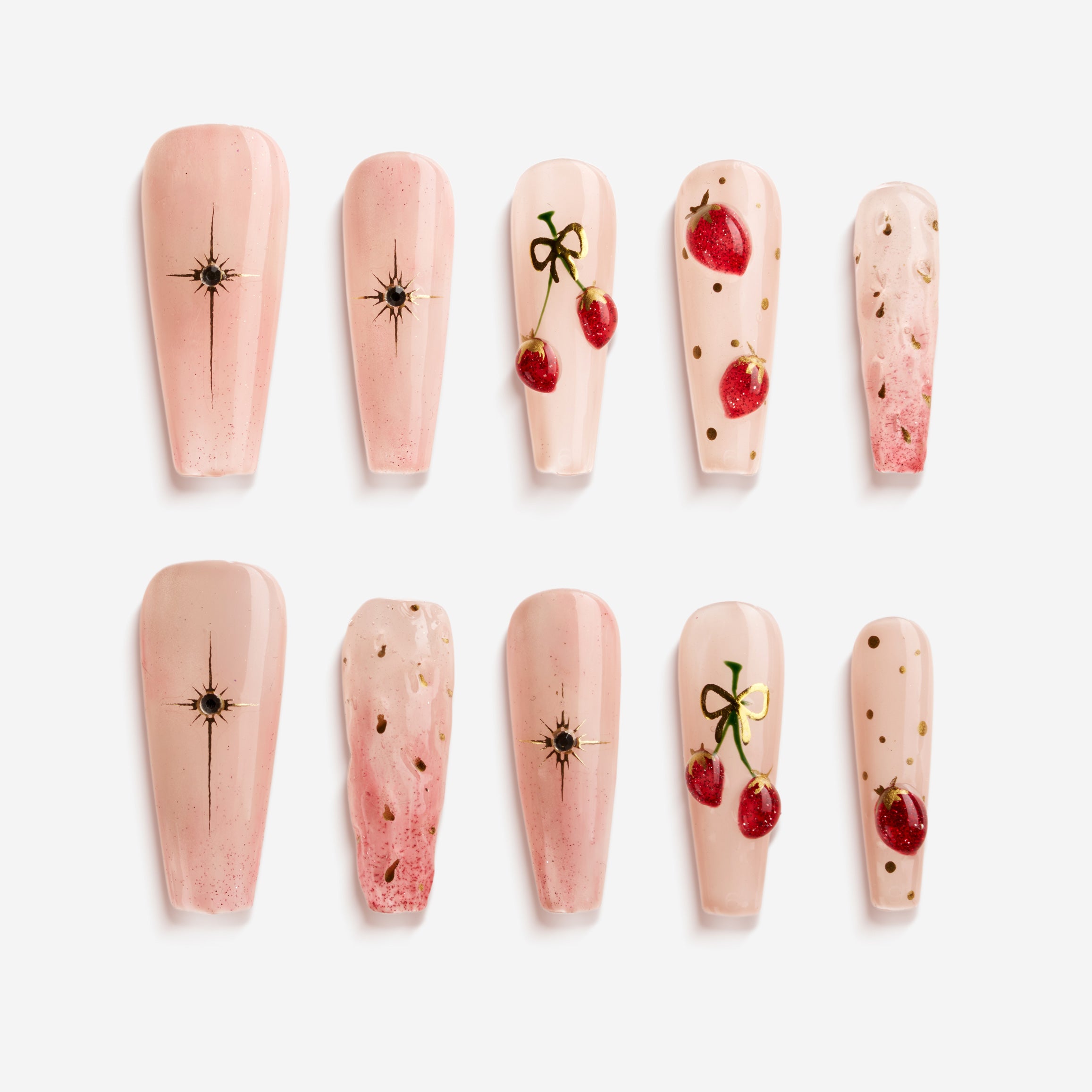 Cherry Glow nude press on nails with cherry accents and glossy finish