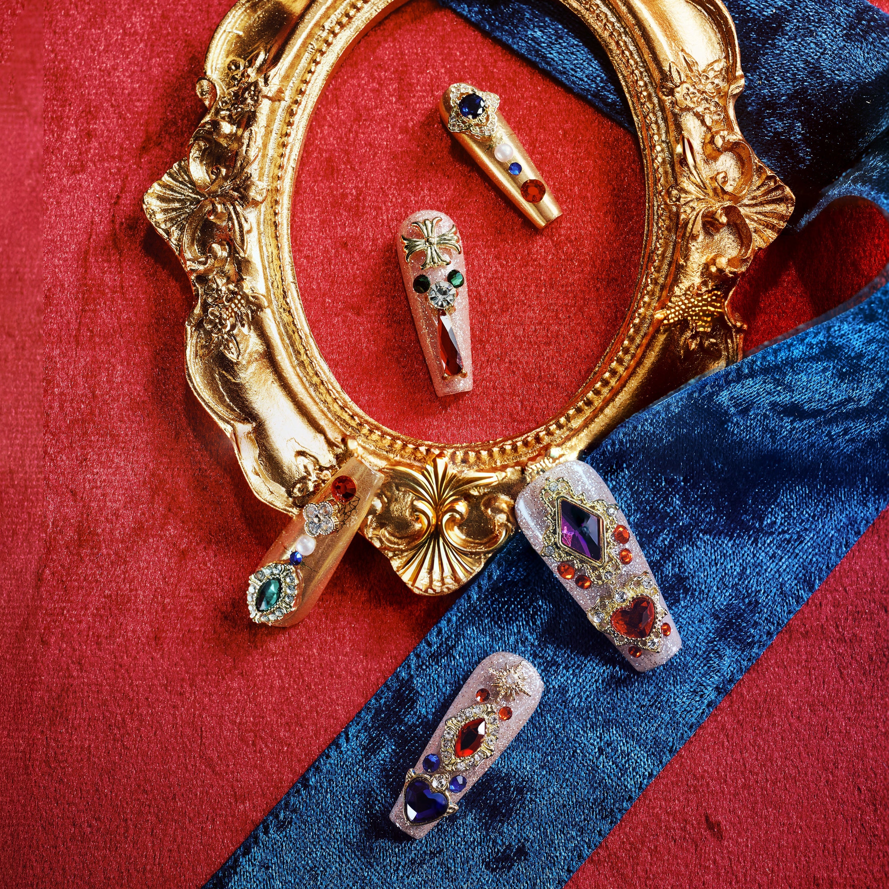 Royal-inspired luxury press on nails with ornate gemstone details. Handmade reusable nail art set with elegant impact.