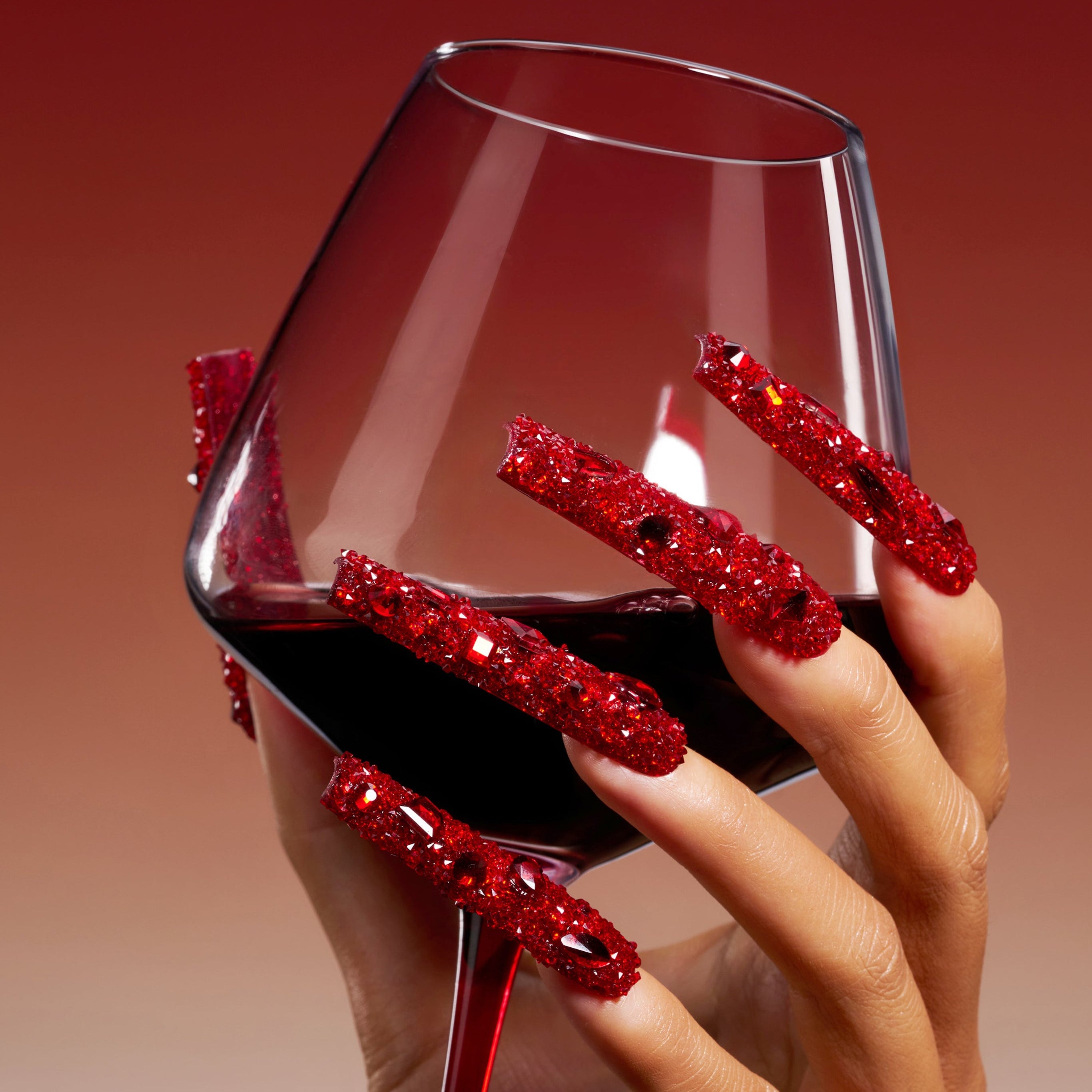 Deep red crystal press on nails with full sparkle coverage. Handmade luxury nail art set for bold glamour looks.