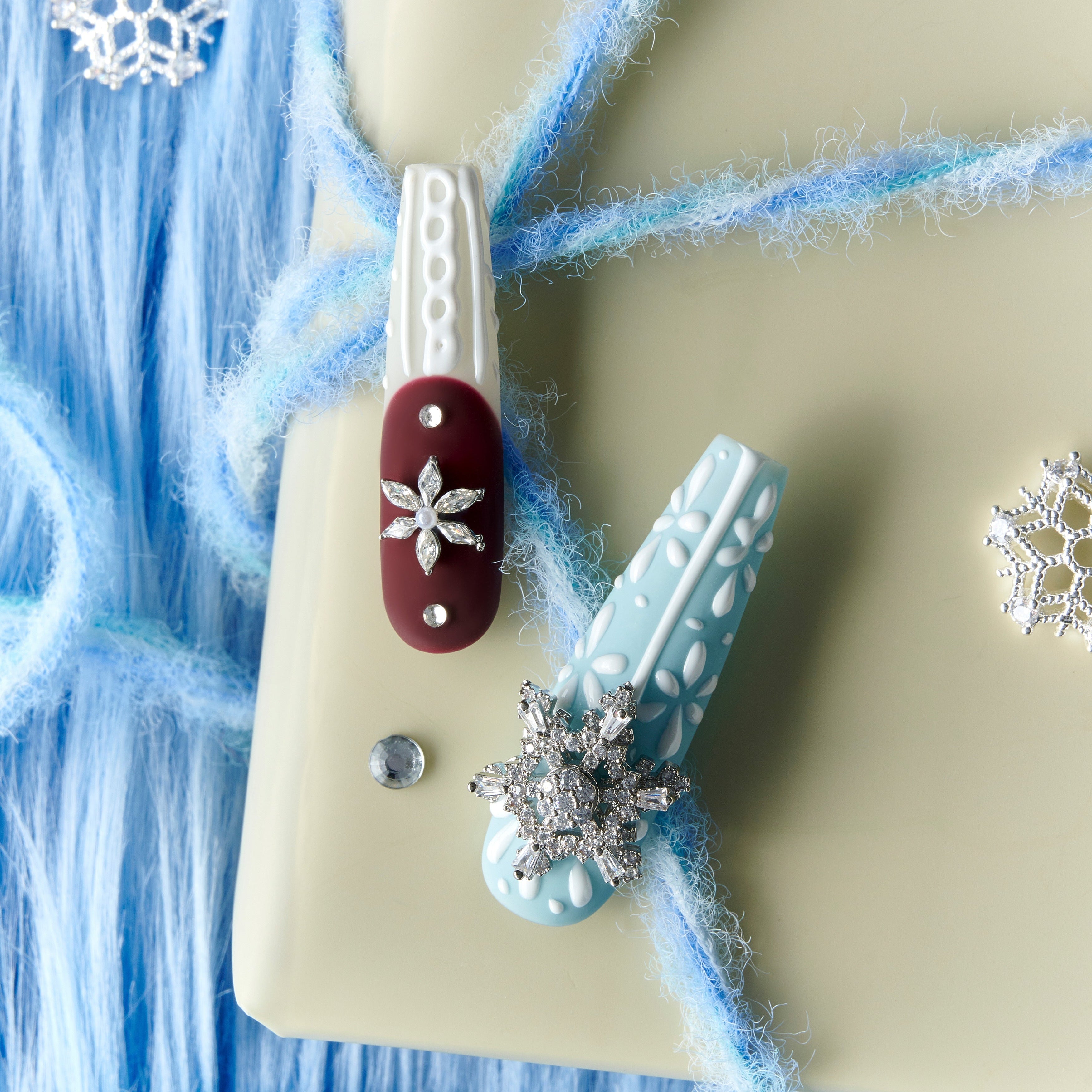 Dance of the Cosmos Christmas press on nails with 3D knit texture, snowflake charms, red and blue winter design long nail