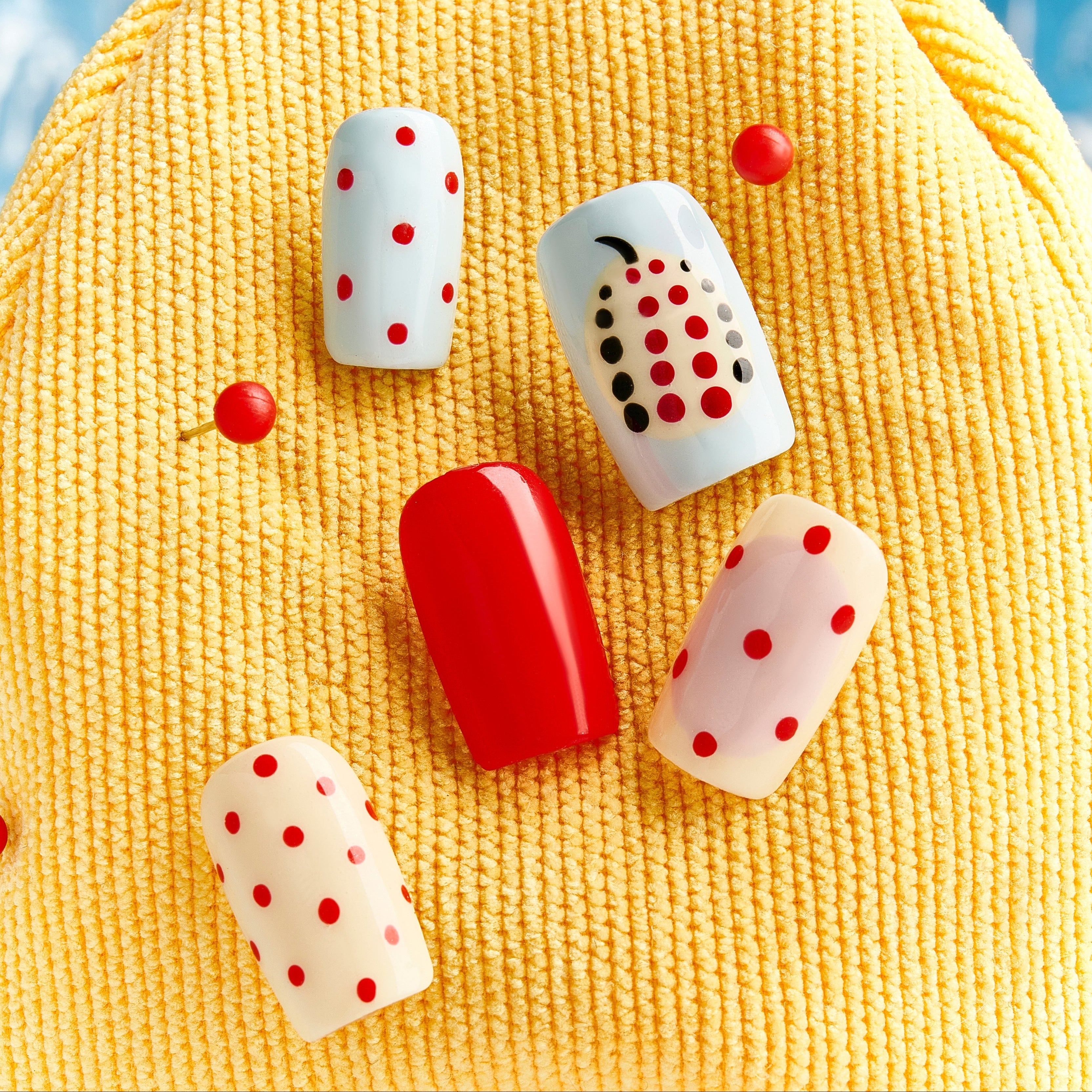 Polka Dot Cherry – red polka dot Christmas press-on nails with pearl cherry details and playful retro look