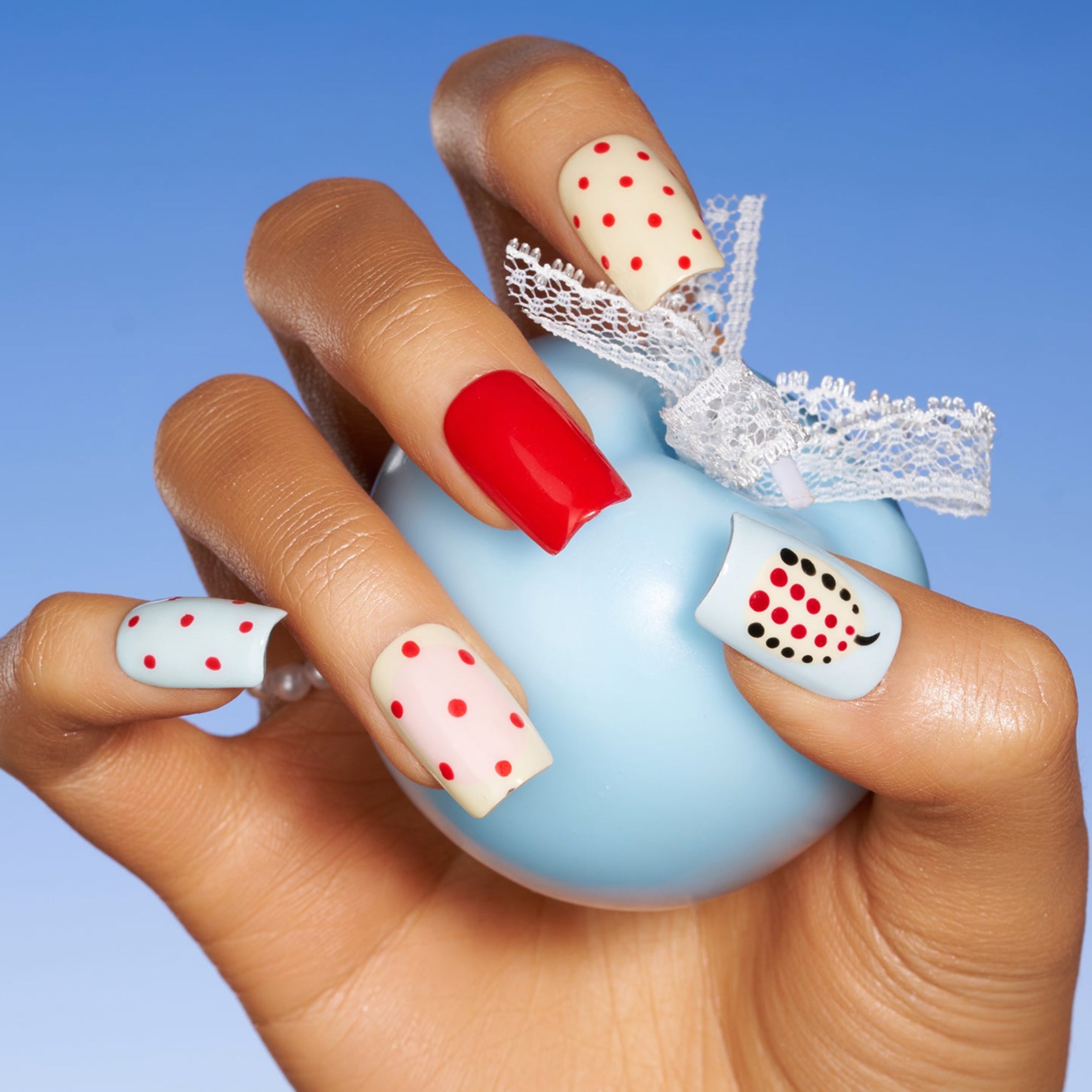Polka Dot Cherry – red polka dot Christmas press-on nails with pearl cherry details and playful retro look