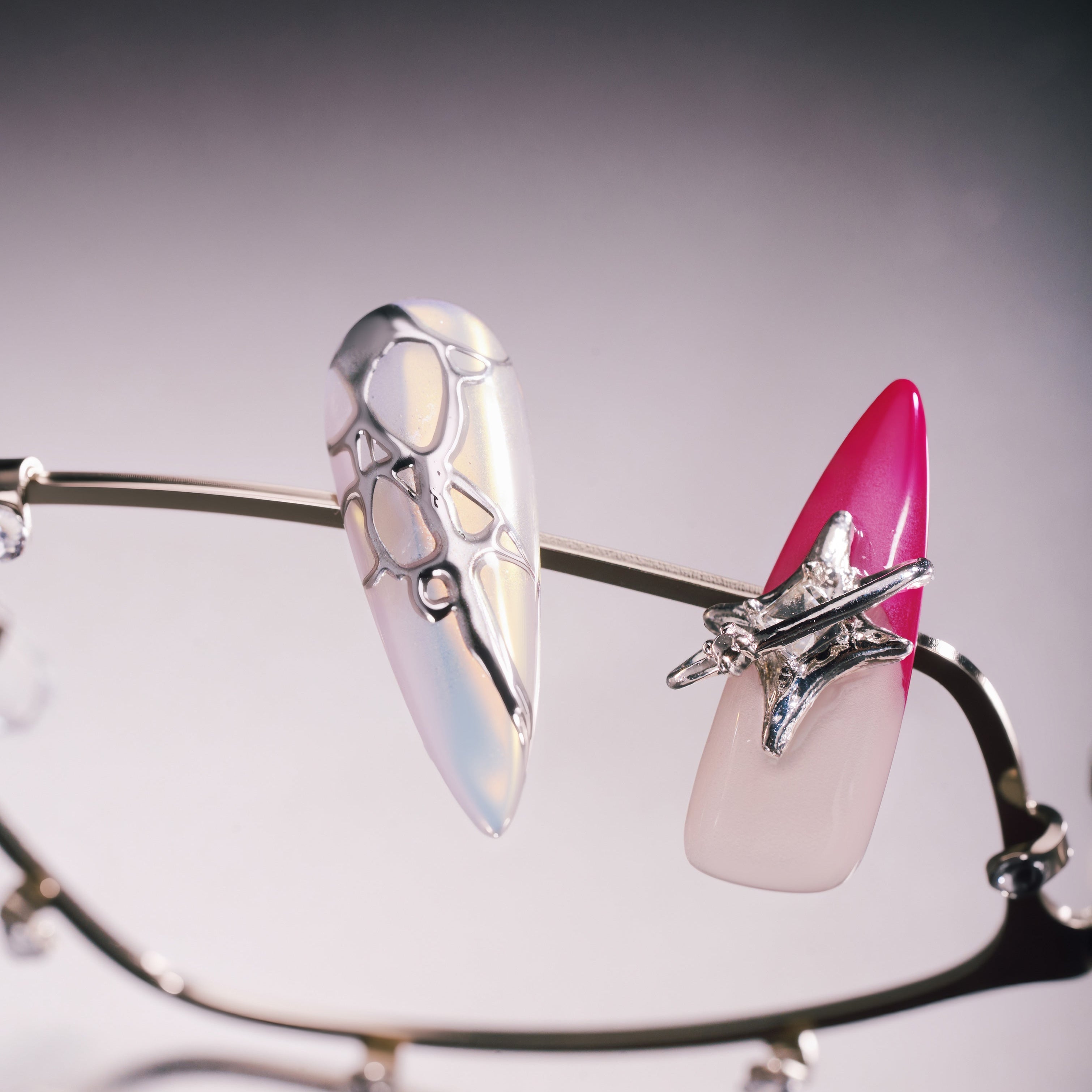 Stellar Bloom – pink gradient press-on nails with silver star and chrome accents