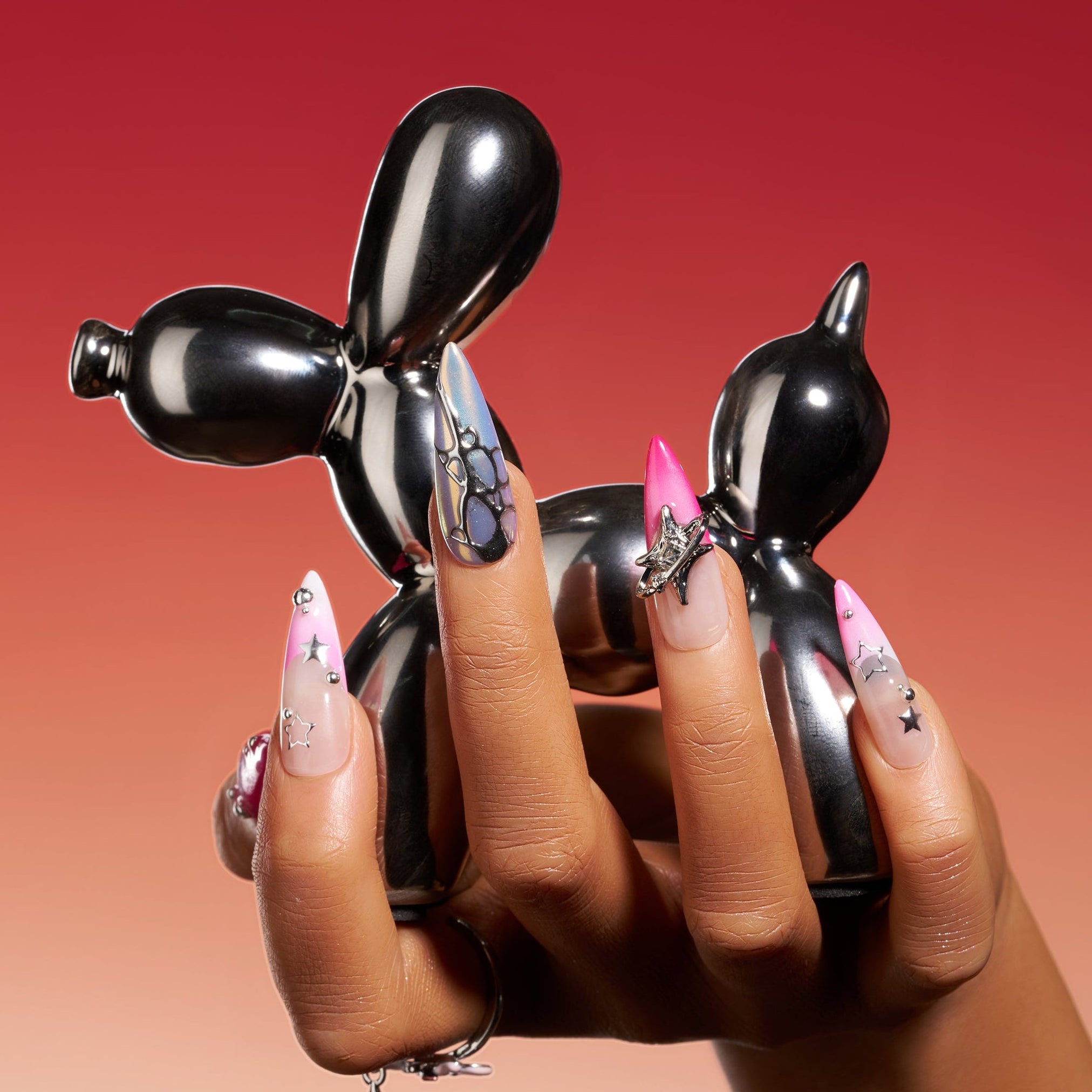 Stellar Bloom – pink gradient press-on nails with silver star and chrome accents