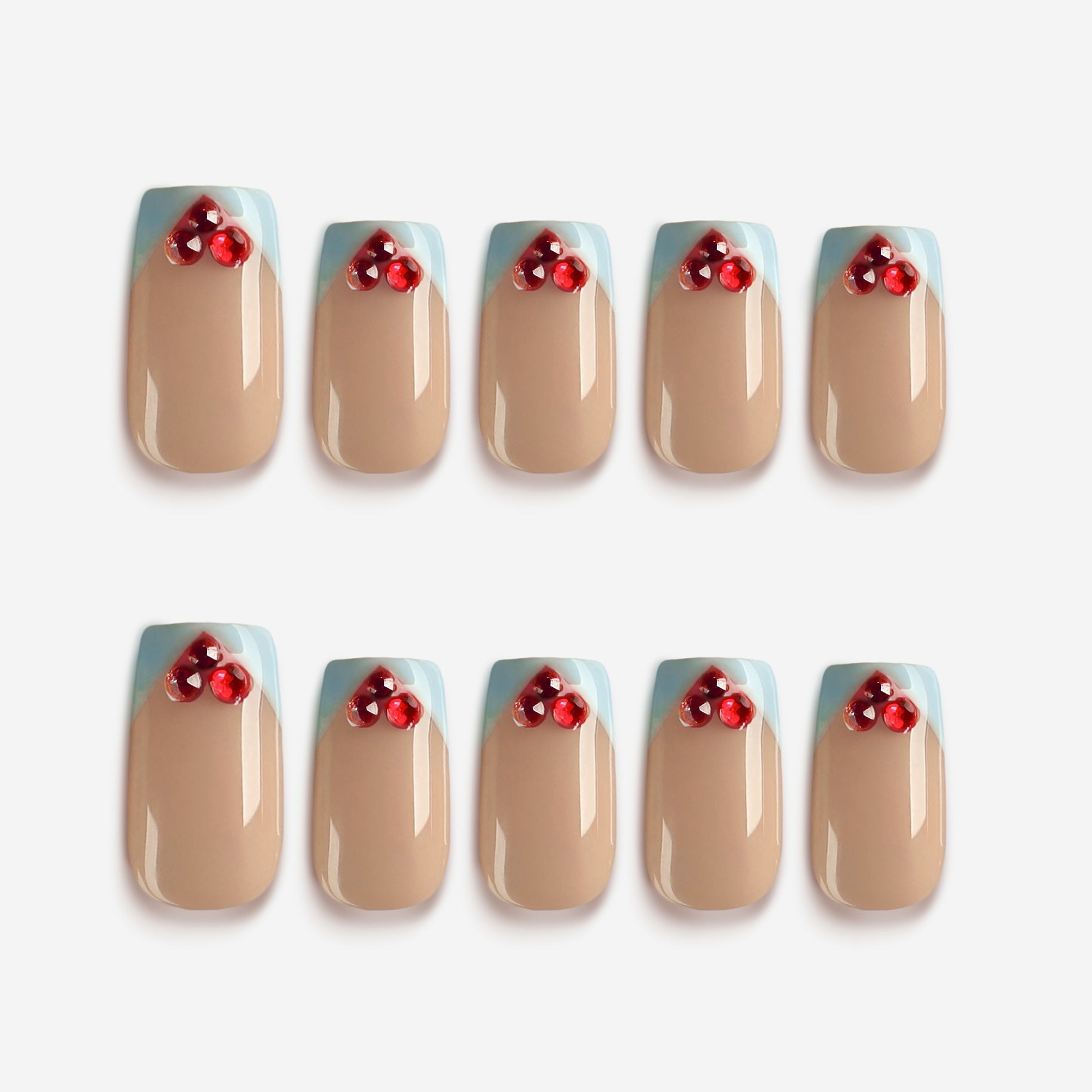 Sweet Heart Pink – nude and blue French tip press-on nails with red crystals
