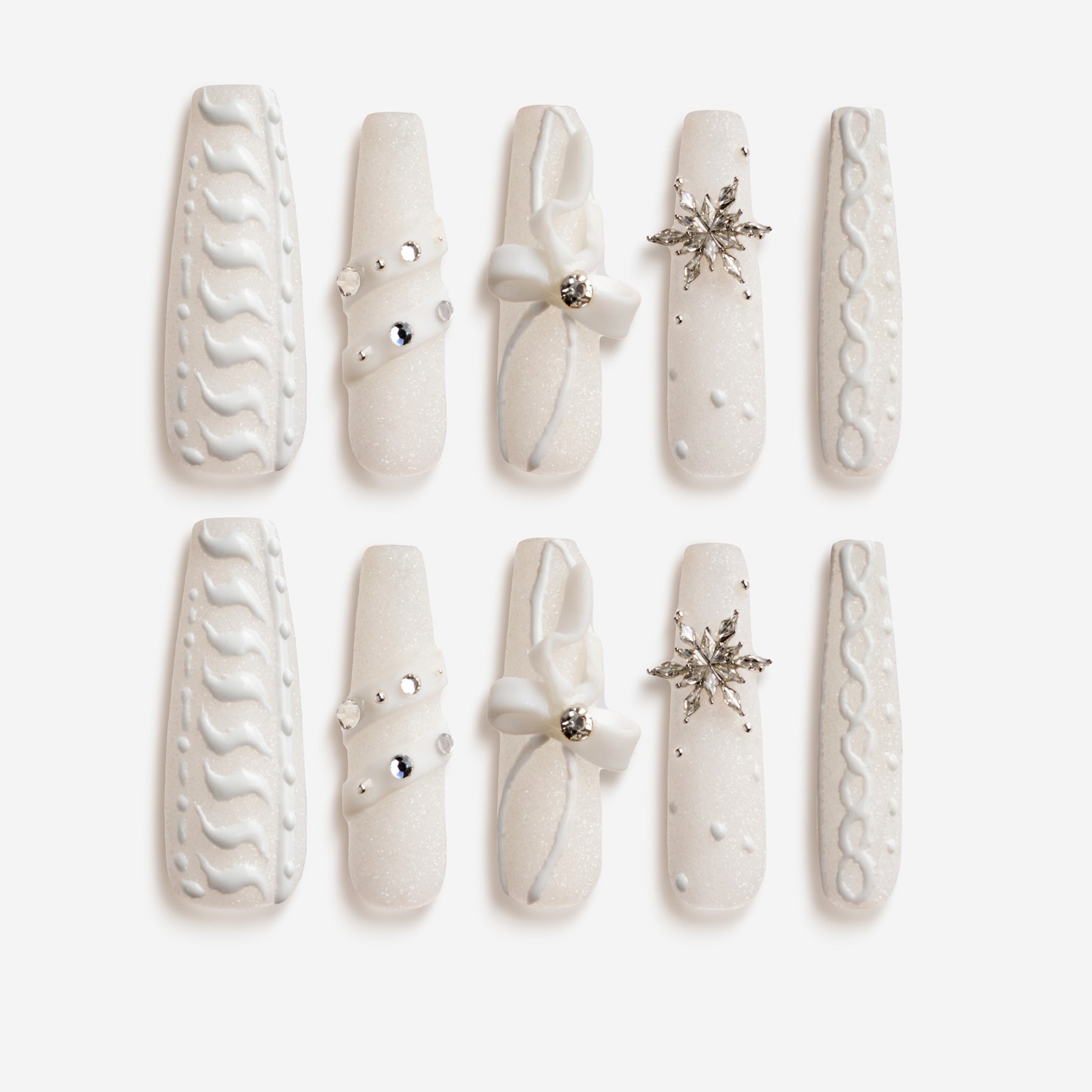 Winter Snowflakes – white press-on nails with 3D snowflake carvings, ribbons, and pearl details for Christmas and winter