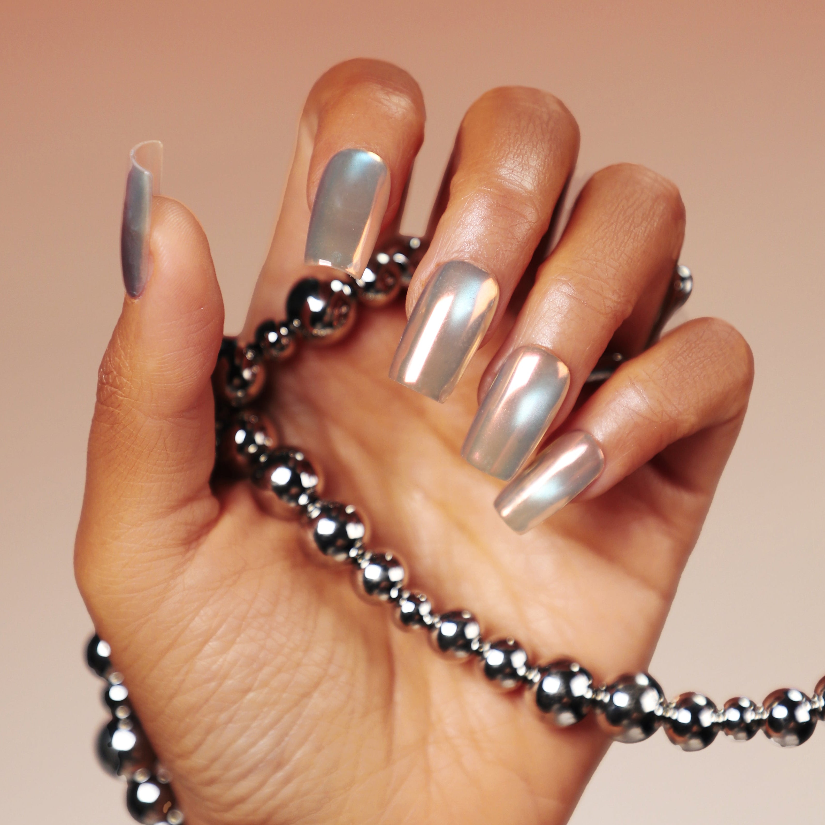 Moonbow Icing press on nails featuring milky white iridescent glow. Trendy luminous false nails.