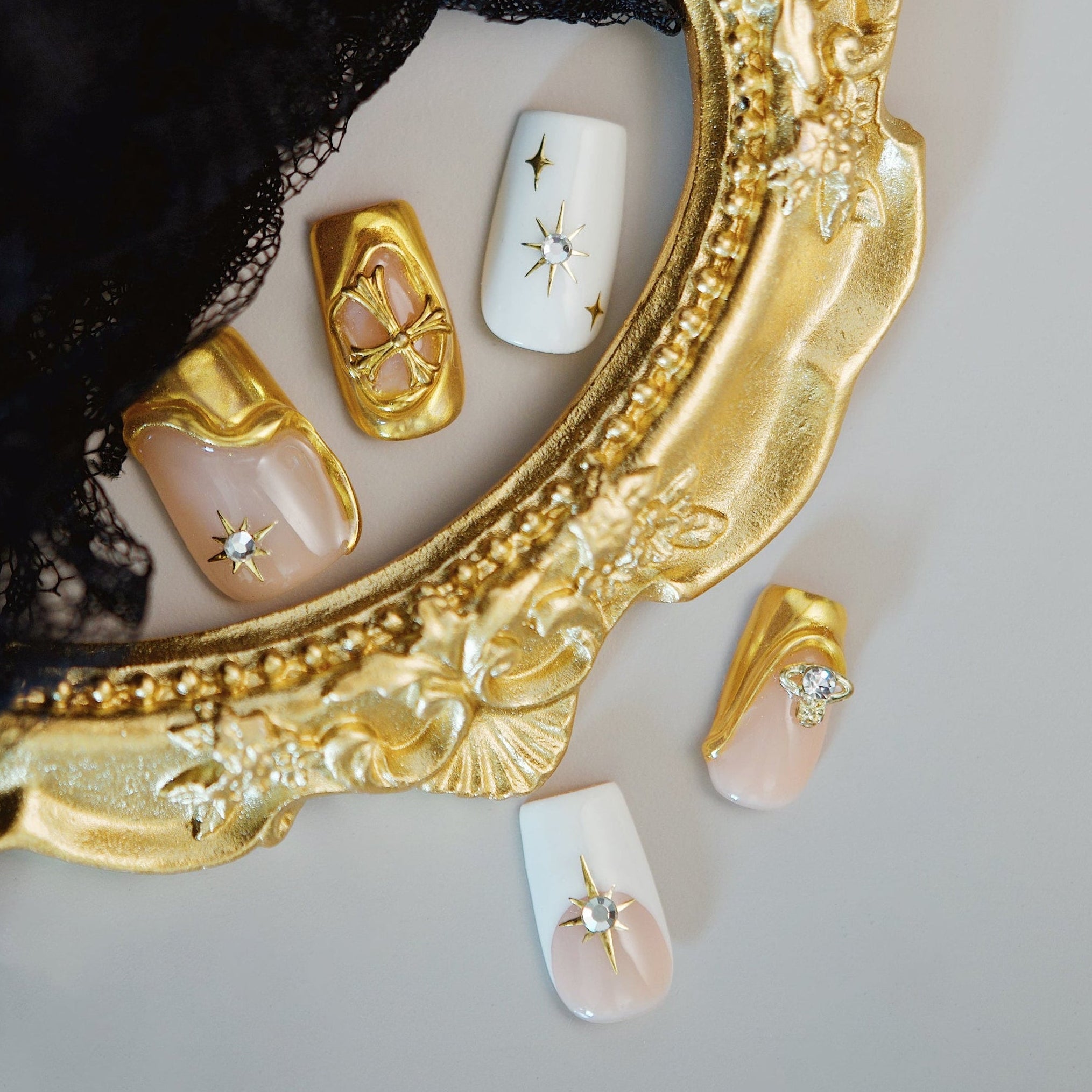 Nude French press on nails with bold crystal embellishments. Elegant sparkle and reusable luxury design.