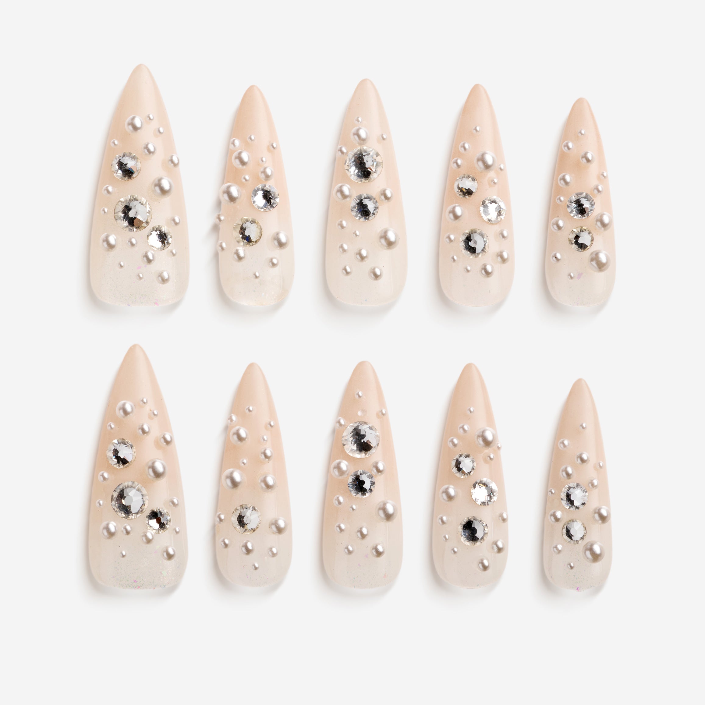 Nude press on nails with pearl and rhinestone clusters for soft luxury style