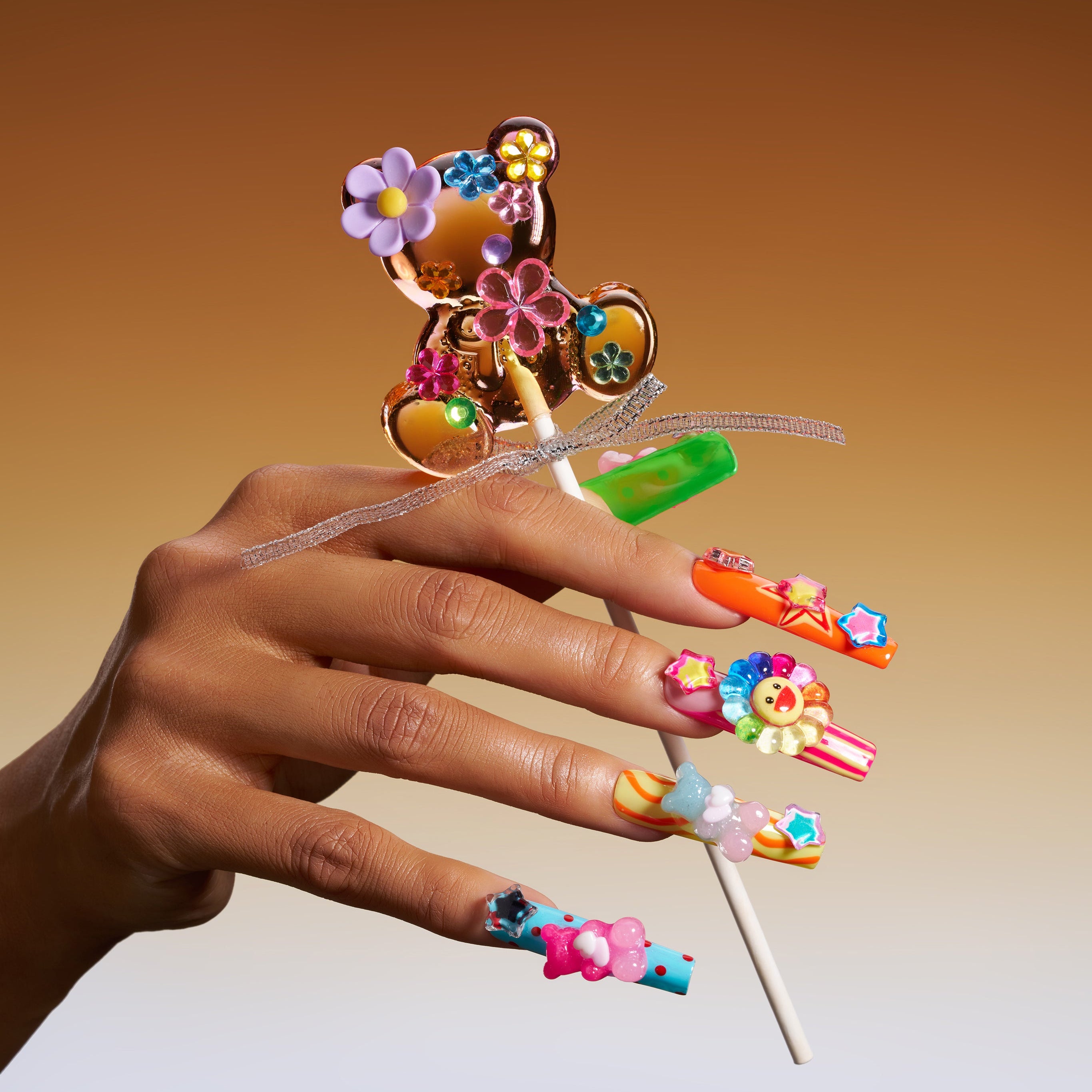 Colorful 3D press on nails with star and teddy details. Bold, playful and reusable.