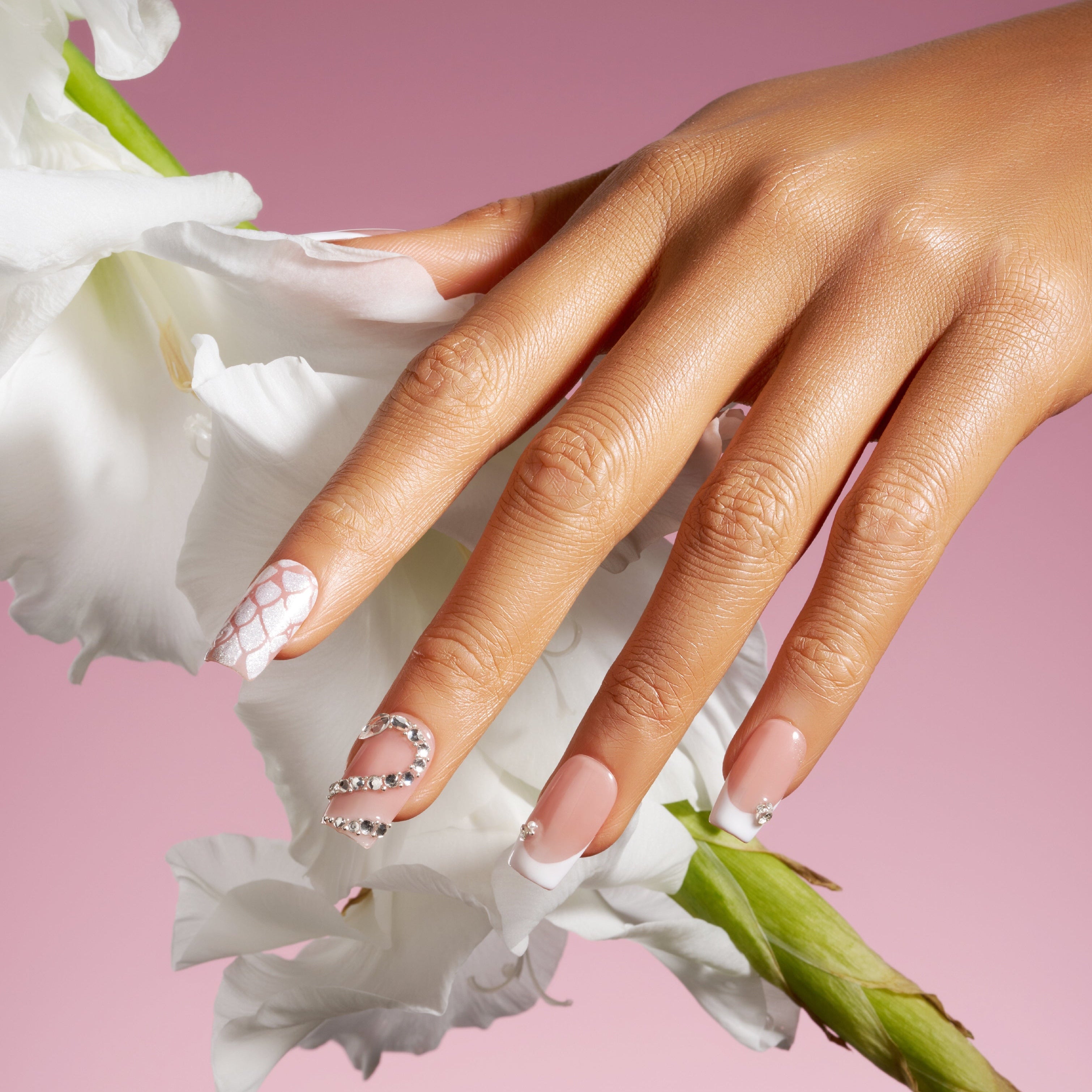 Elegant nude pink French press on nails with crystal accents. Minimal, glossy and reusable.
