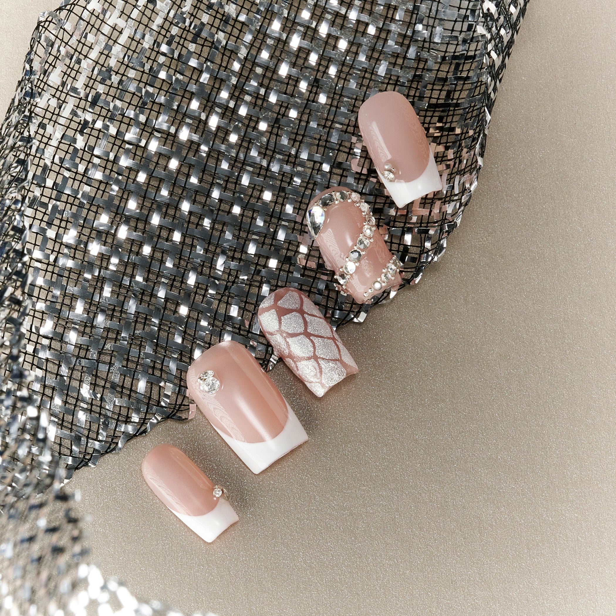 Elegant nude pink French press on nails with crystal accents. Minimal, glossy and reusable.