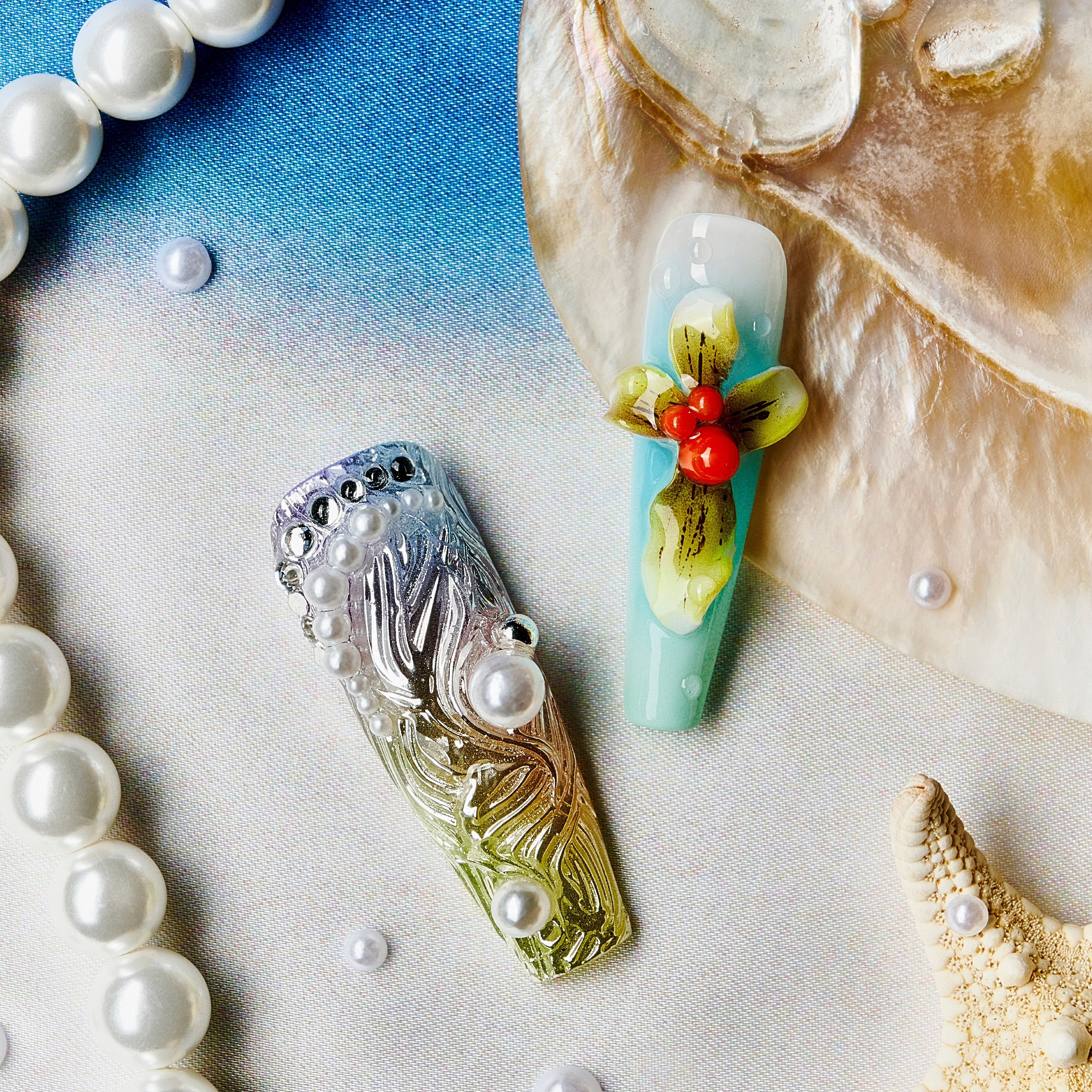 Oceanic Enchantment press-on nails with seashell designs, starfish charms, coral accents, and pearl decorations