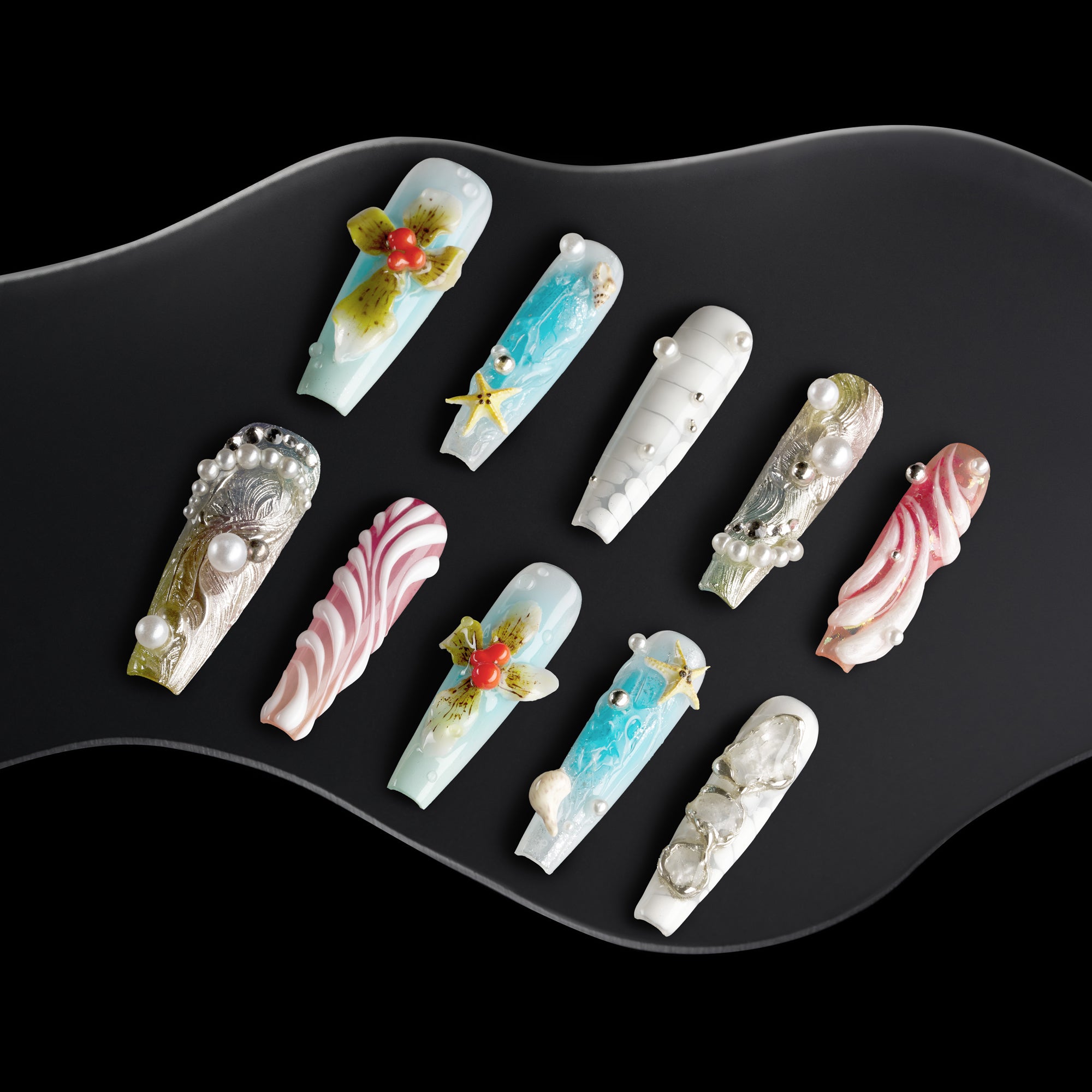 Oceanic Enchantment press-on nails with seashell designs, starfish charms, coral accents, and pearl decorations