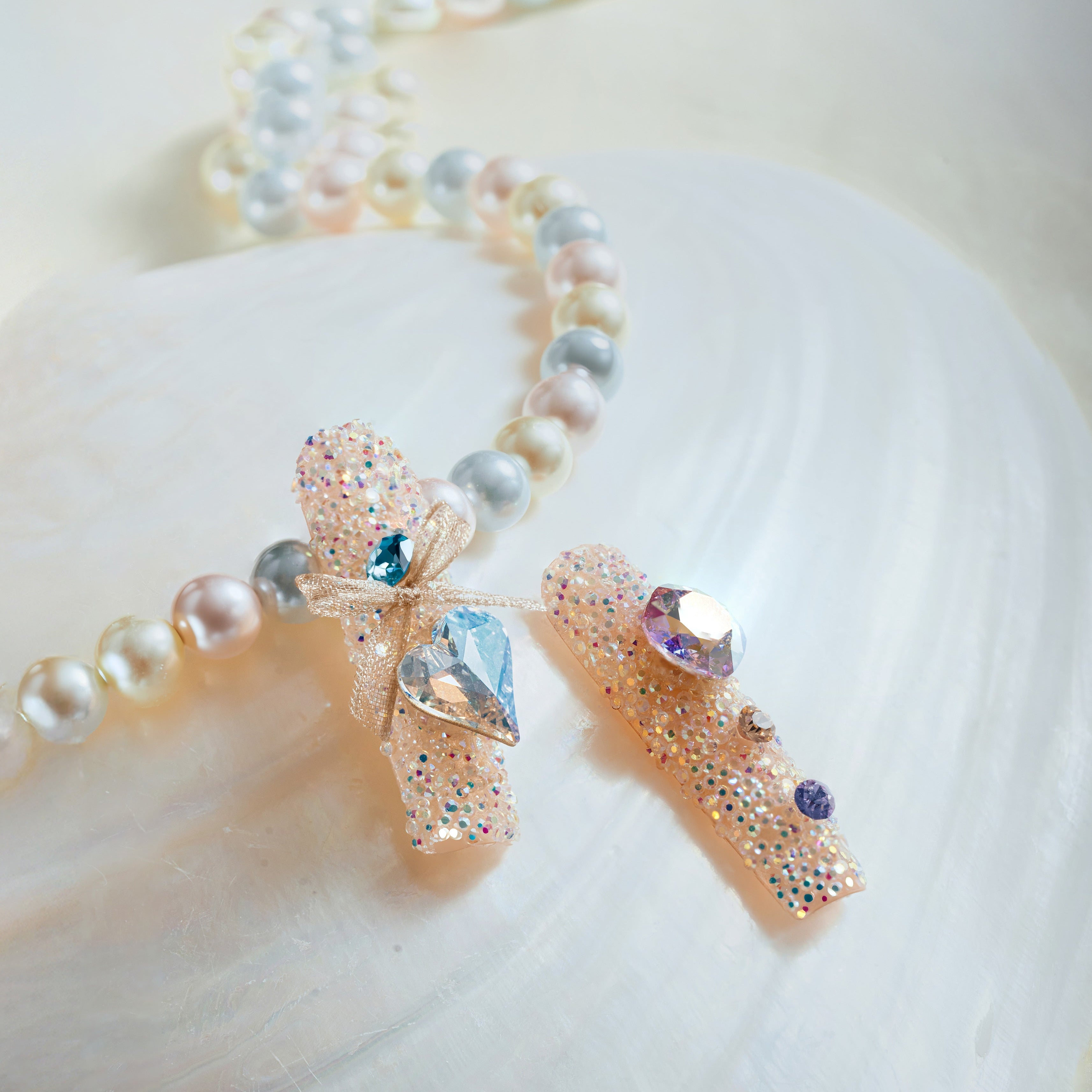 Luxury press on nails featuring genuine Swarovski® crystals. High-shine glam reusable nail art set.