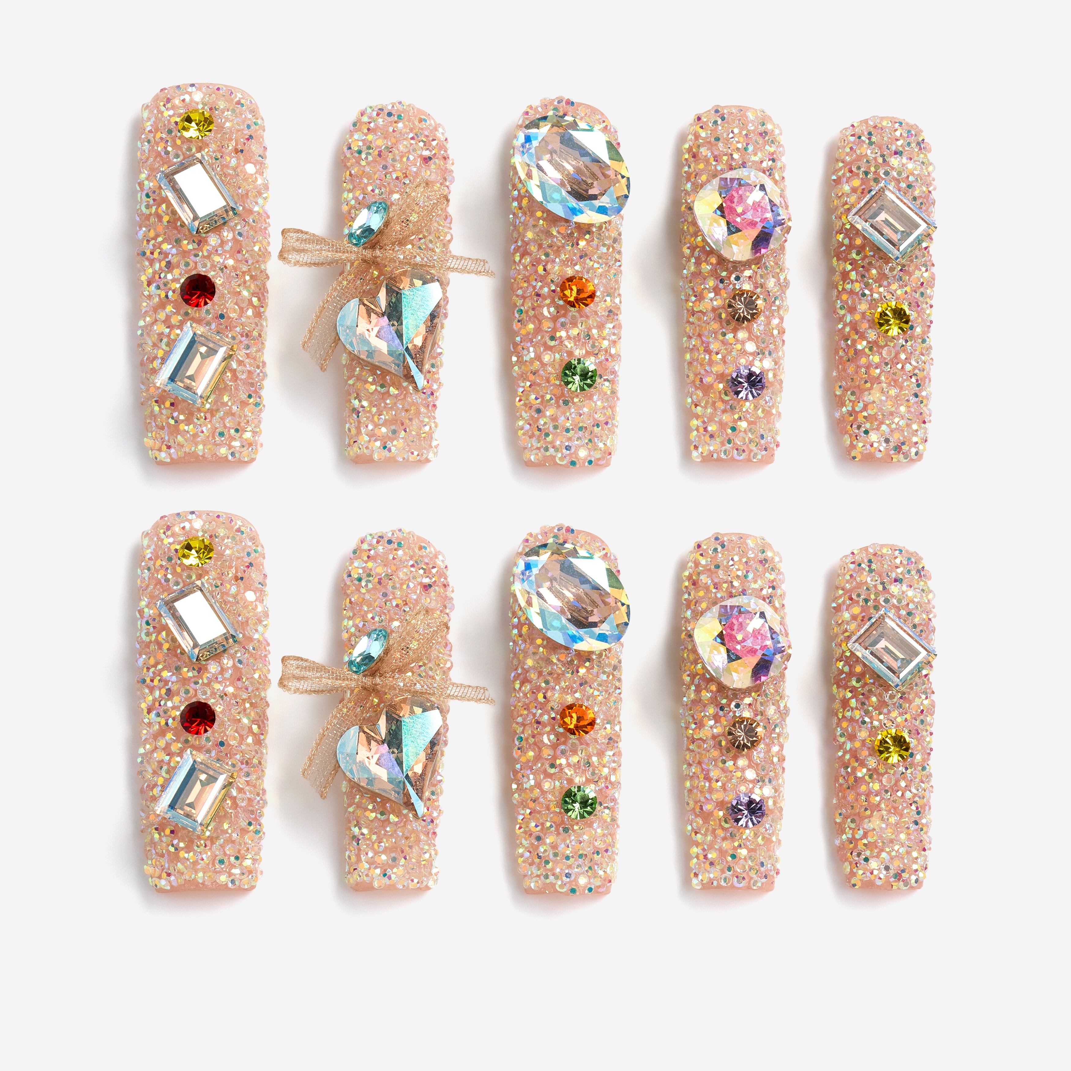 Luxury press on nails featuring genuine Swarovski® crystals. High-shine glam reusable nail art set.