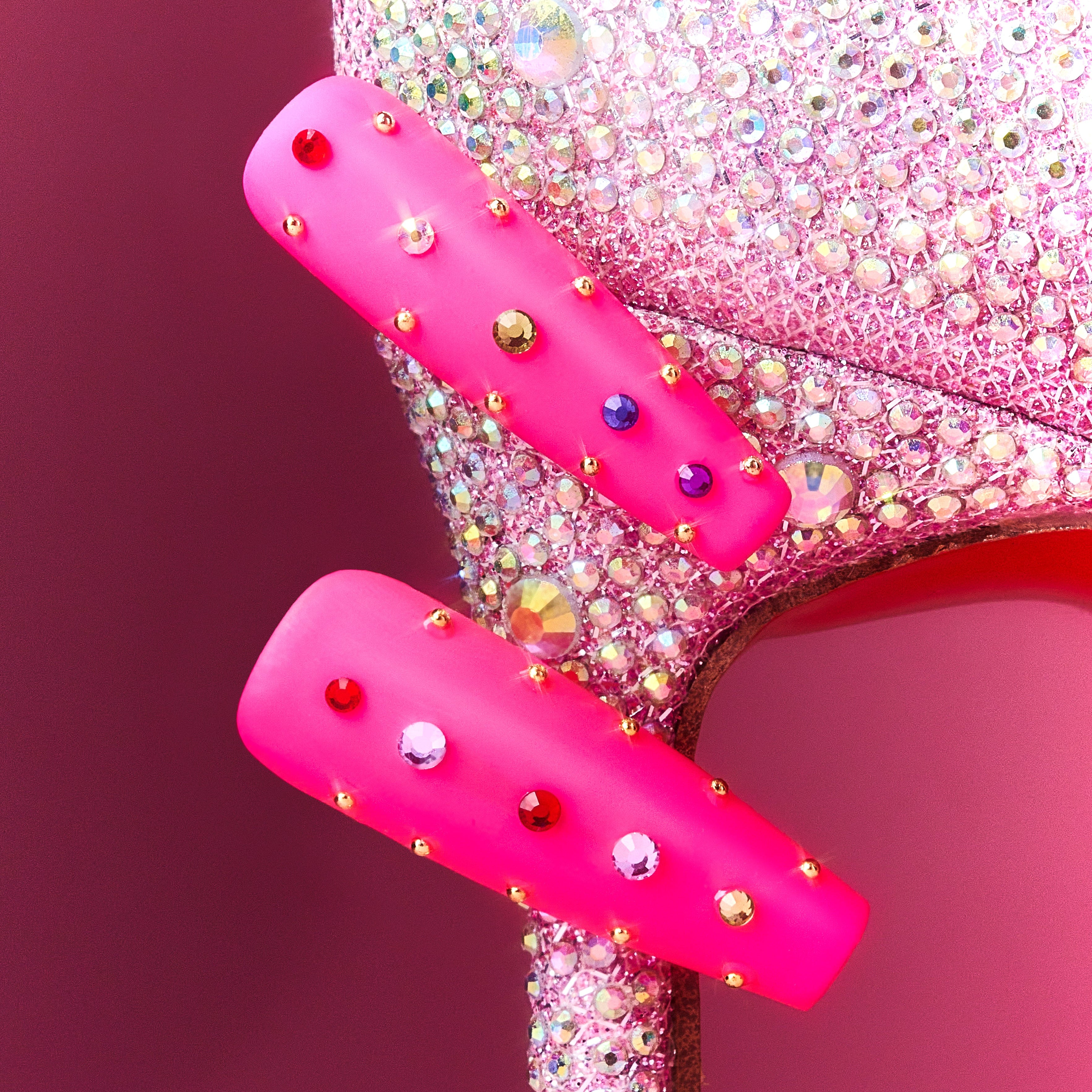 Hot pink luxury press on nails with multicolor crystal embellishments