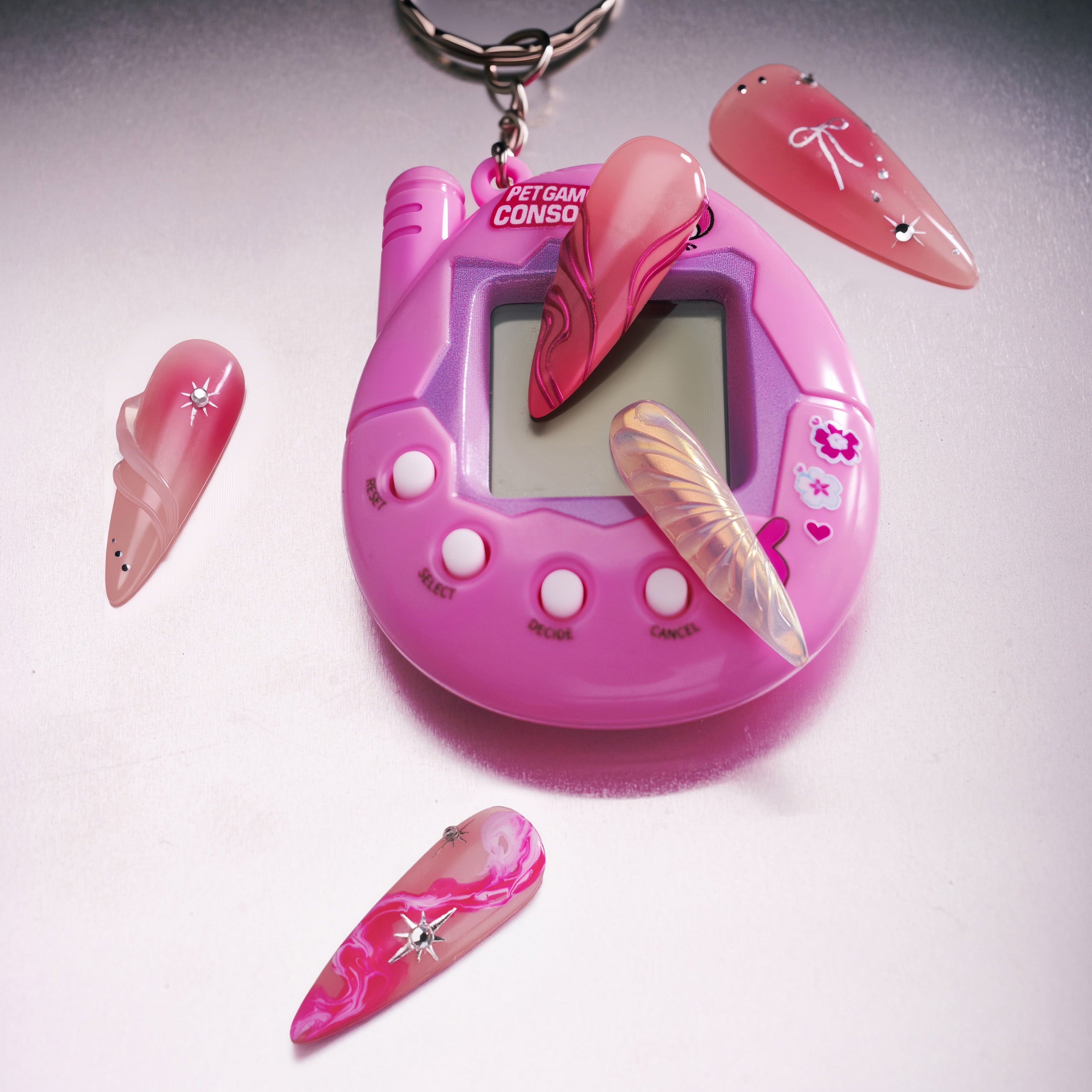 Radiant Sheen long almond press on nails with pink gradients and iridescent wing detail