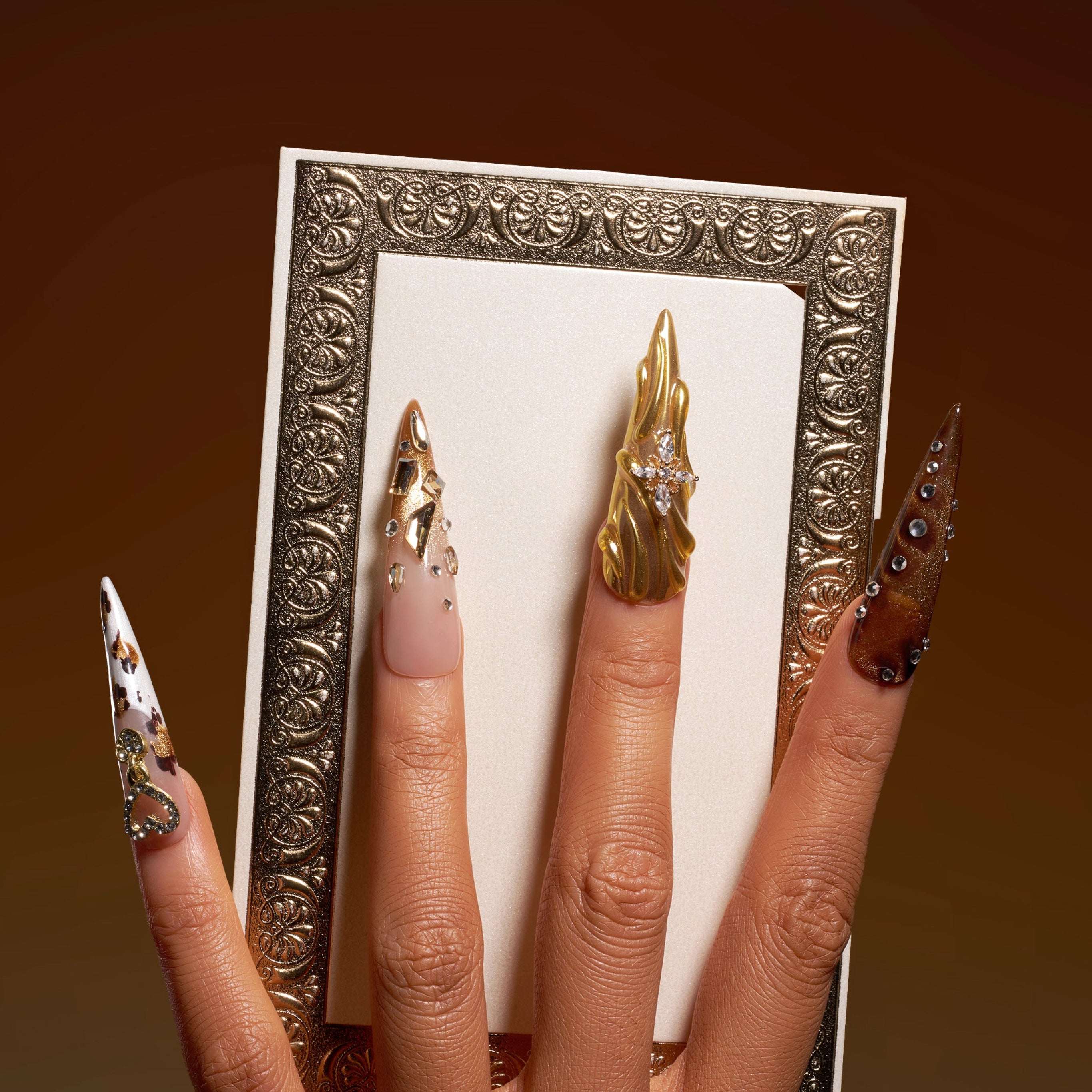 Jewel-inspired luxury press on nails with intricate gemstone arrangements. Handmade reusable nail art set.