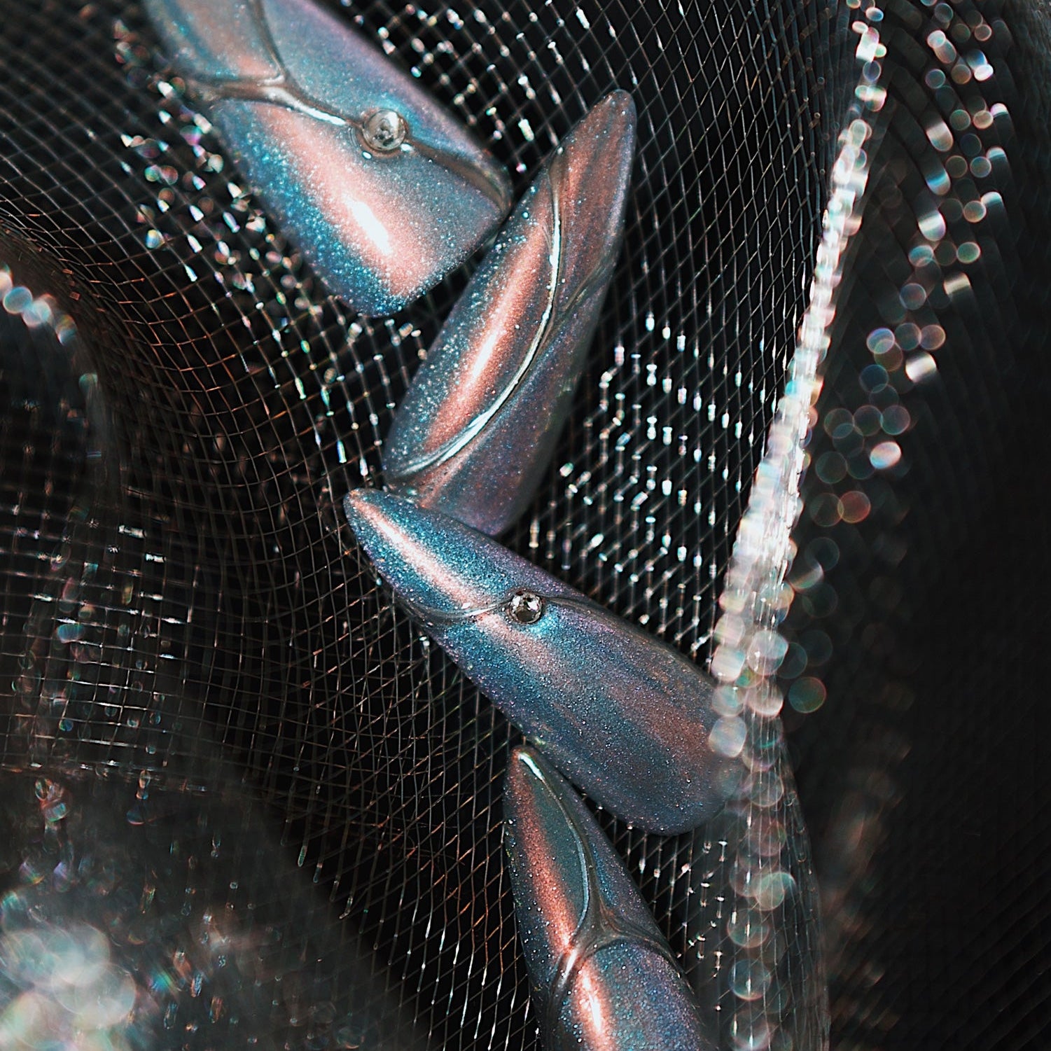 Holographic silver stiletto press on nails with metallic lines and minimalist chrome shine