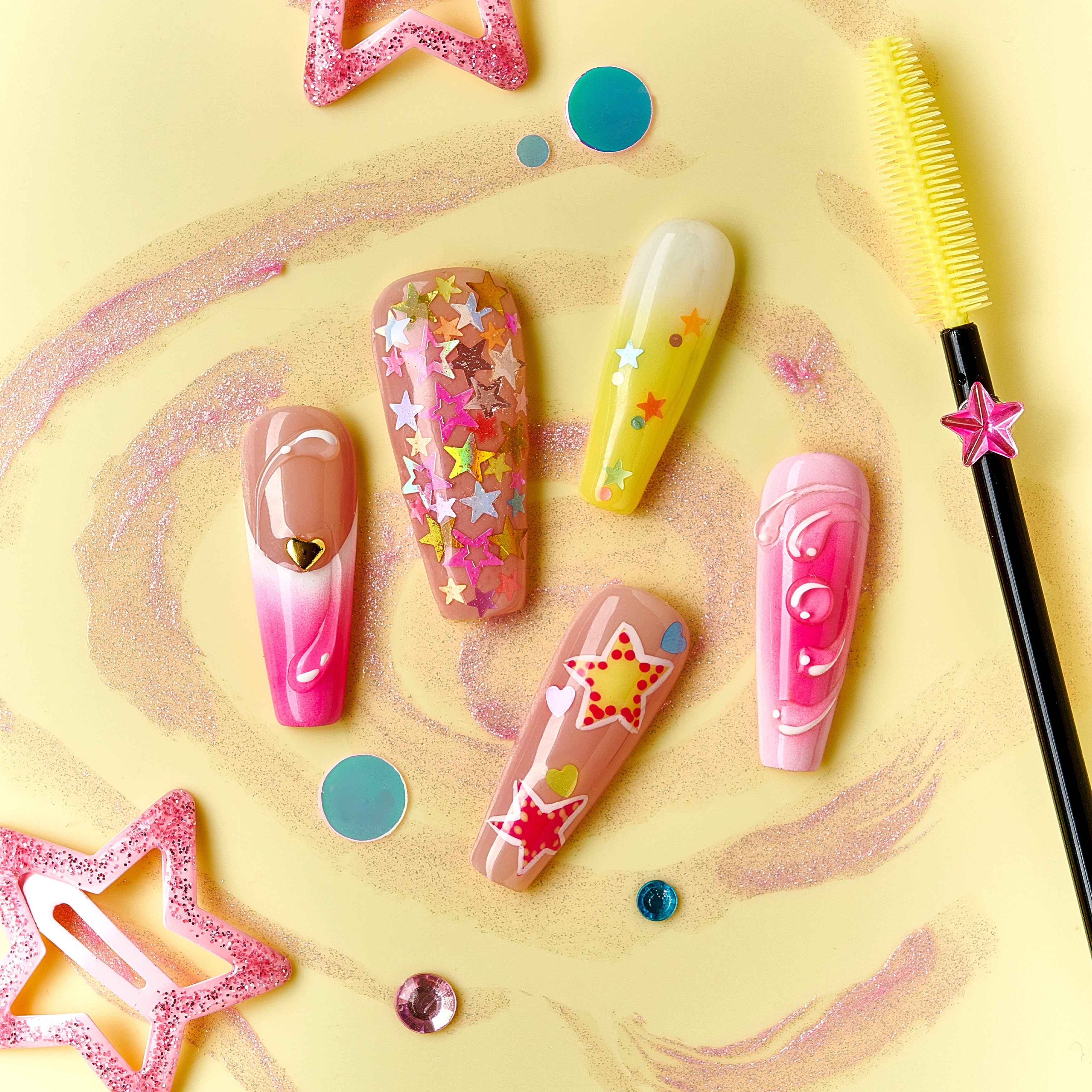 Starry Dream gradient press on nails with colorful star patterns and swirl details.
