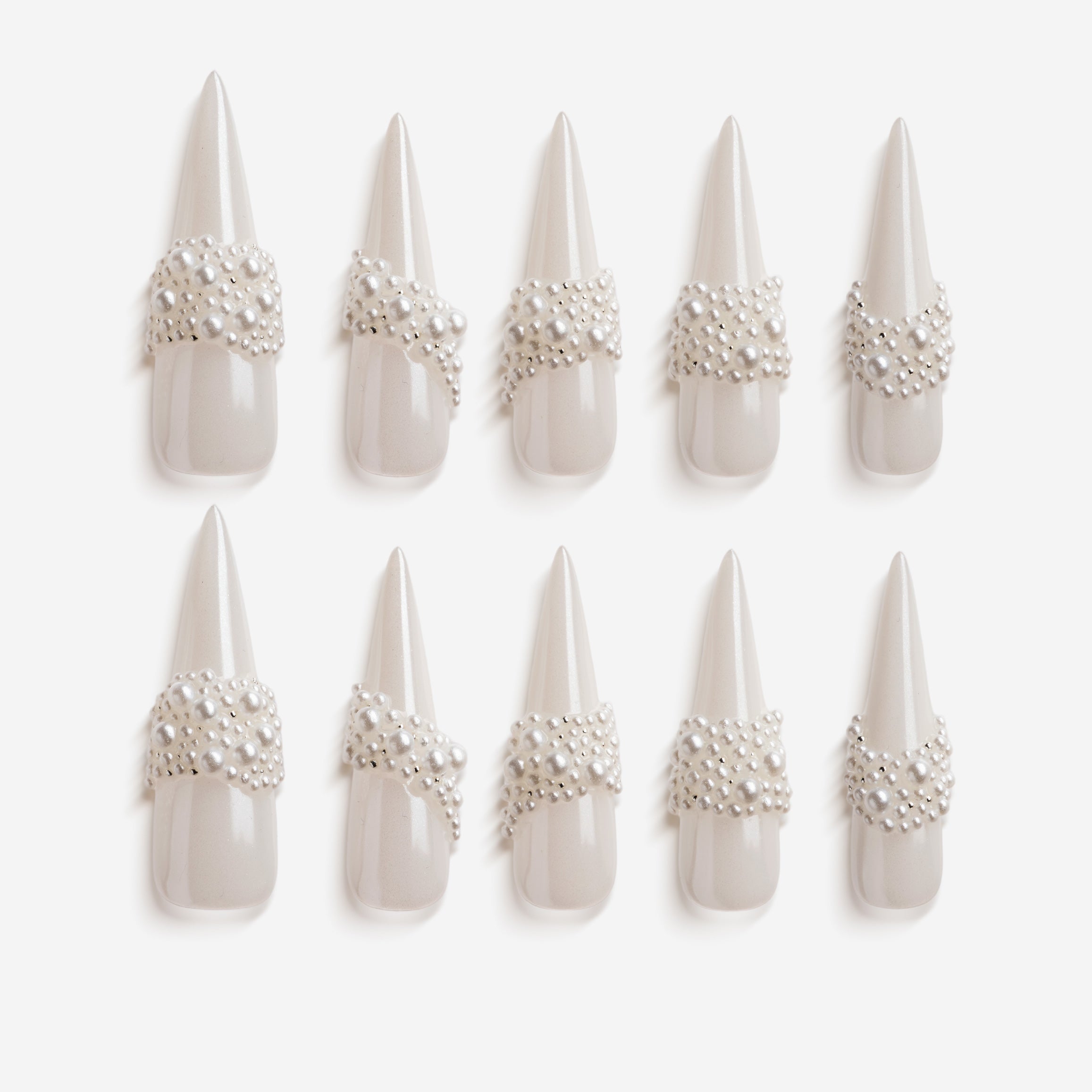 Starry Tips white stiletto press on nails decorated with pearl cluster accents.
