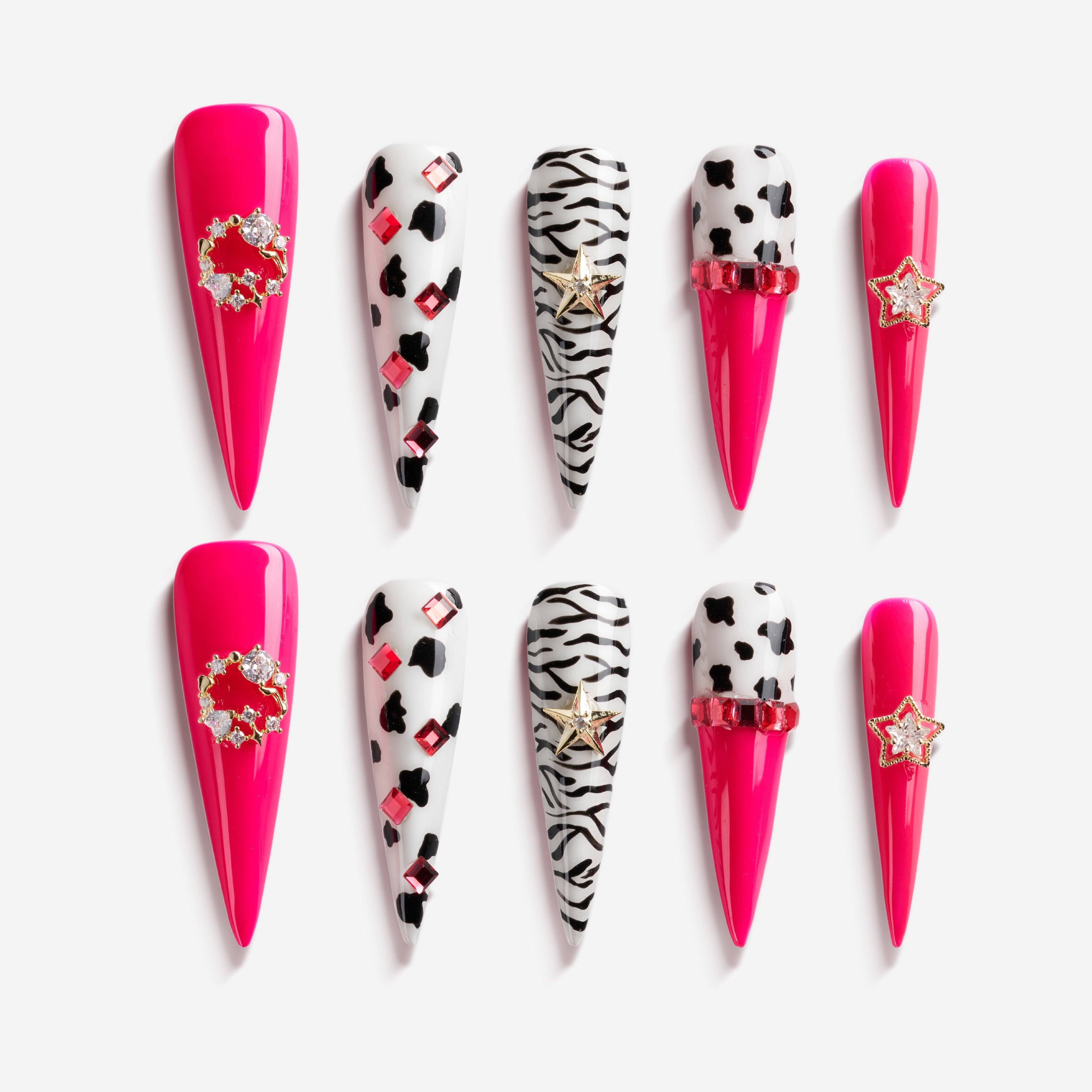 Bold pink press on nails with zebra and leopard accents plus crystal stars. Fun, edgy and reusable.