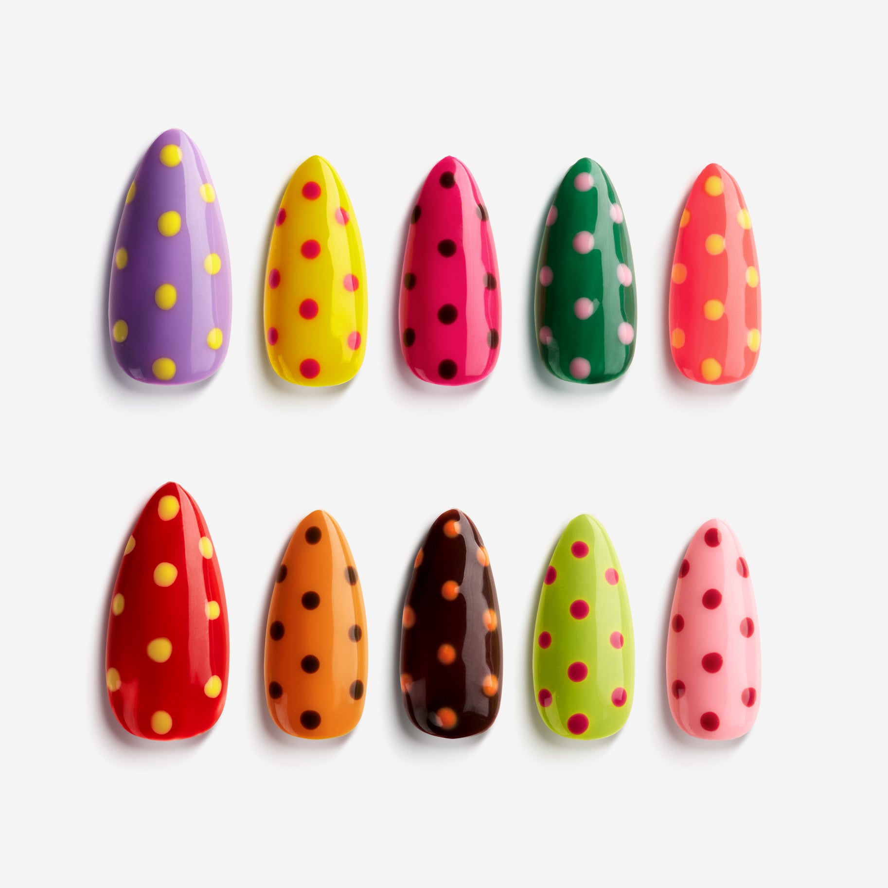 Colorful polka dot press on nails in mixed bright shades for playful nail art looks
