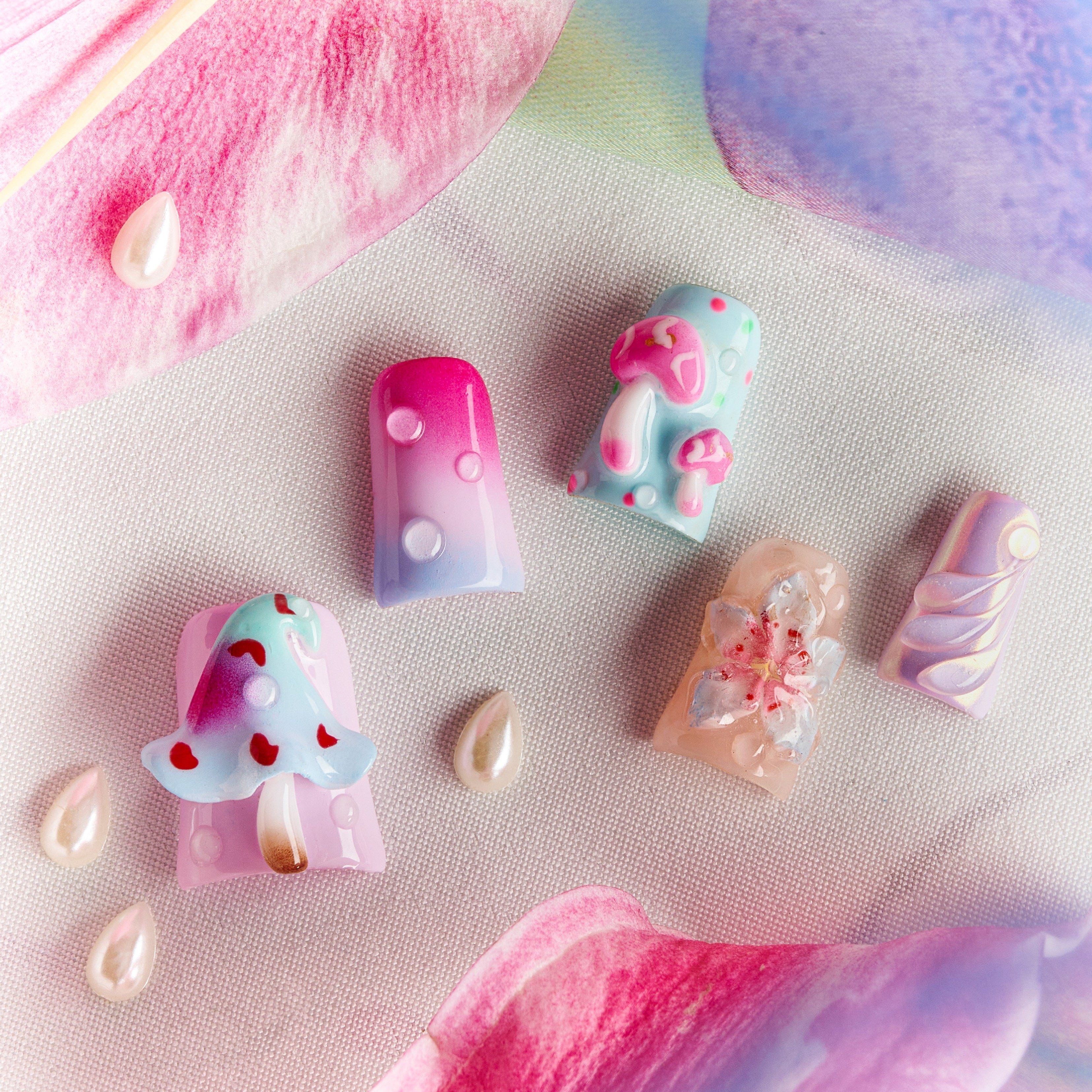 Pastel fantasy press on nails with 3D mushrooms, floral details, and dreamy gradient nail art.