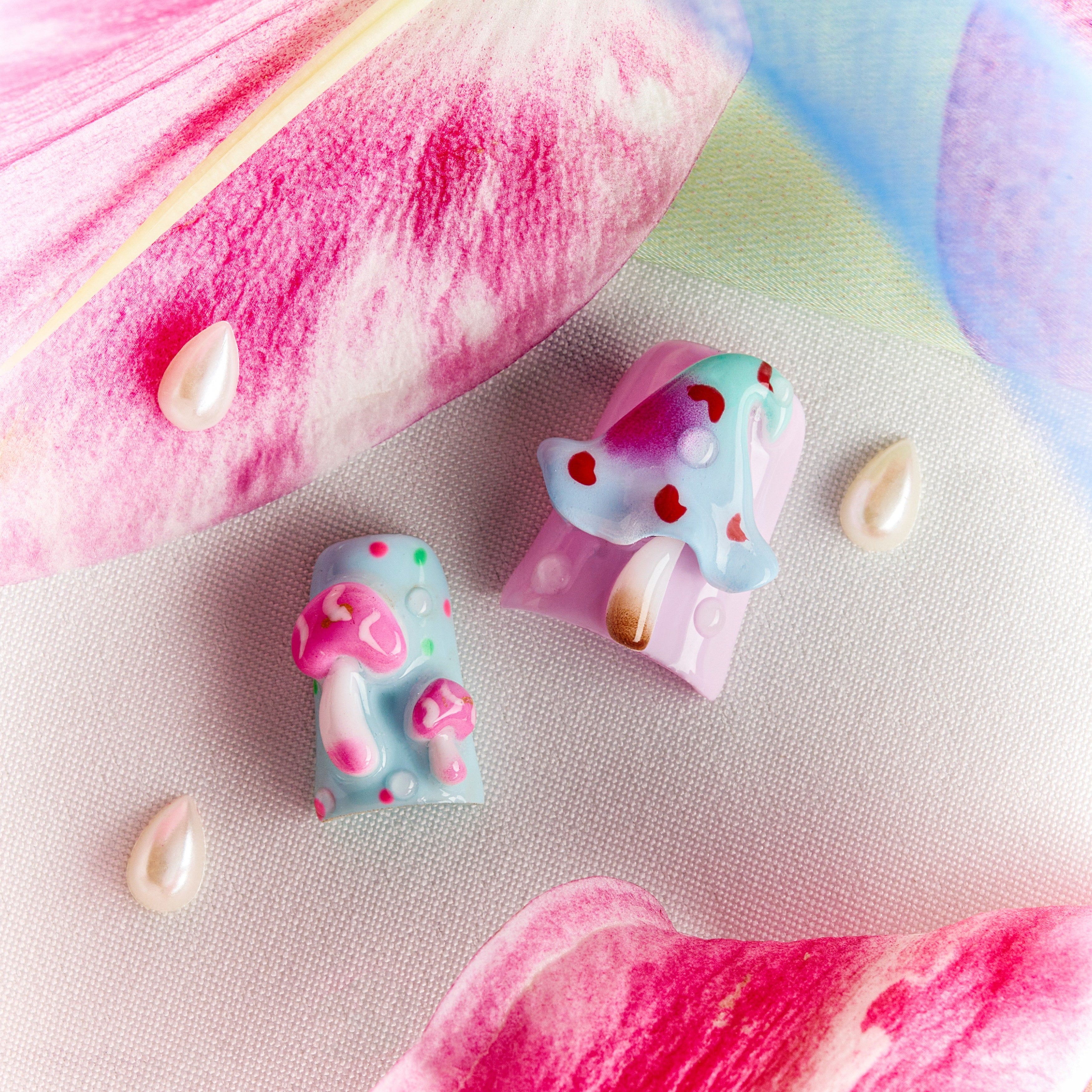 Pastel fantasy press on nails with 3D mushrooms, floral details, and dreamy gradient nail art.