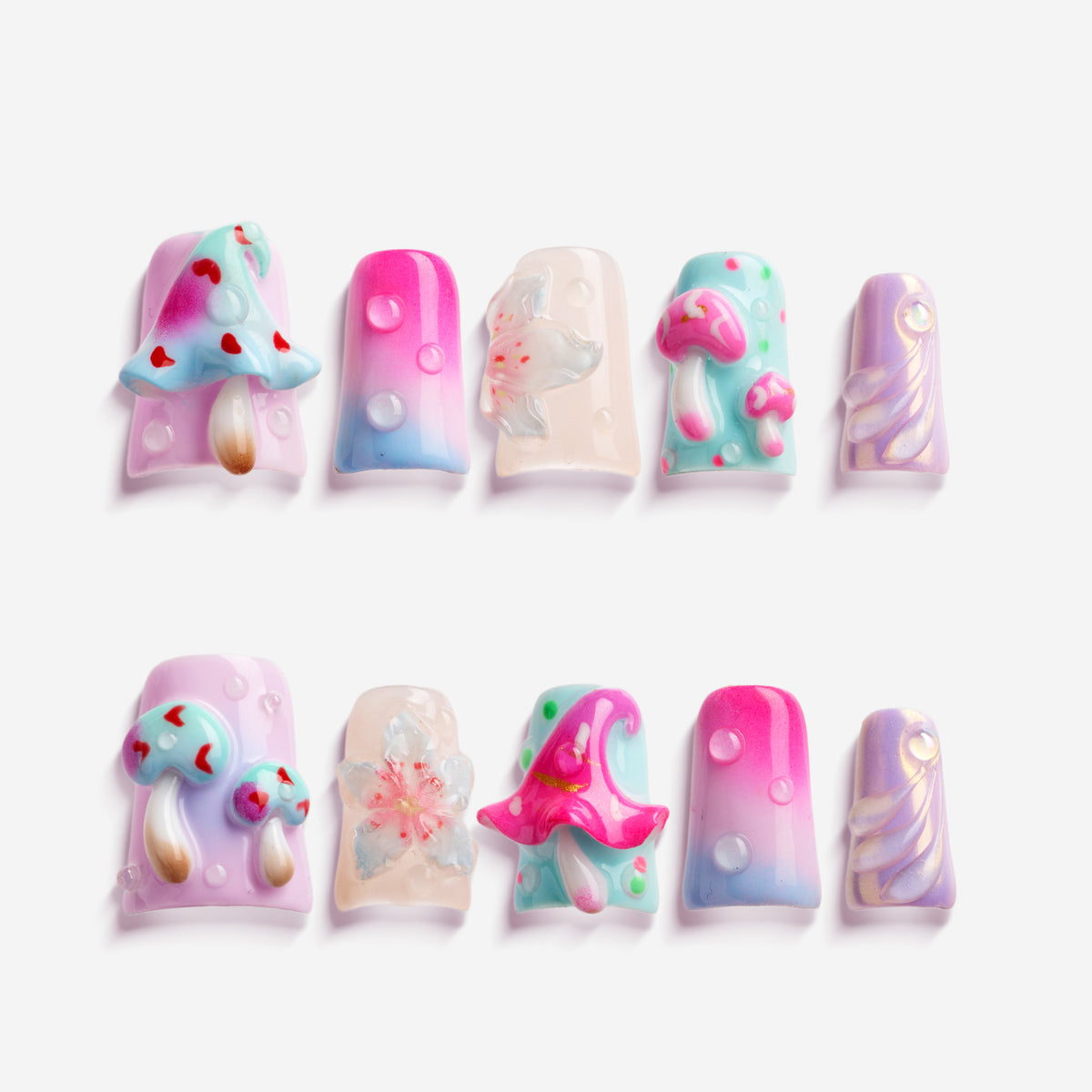 Pastel fantasy press on nails with 3D mushrooms, floral details, and dreamy gradient nail art.