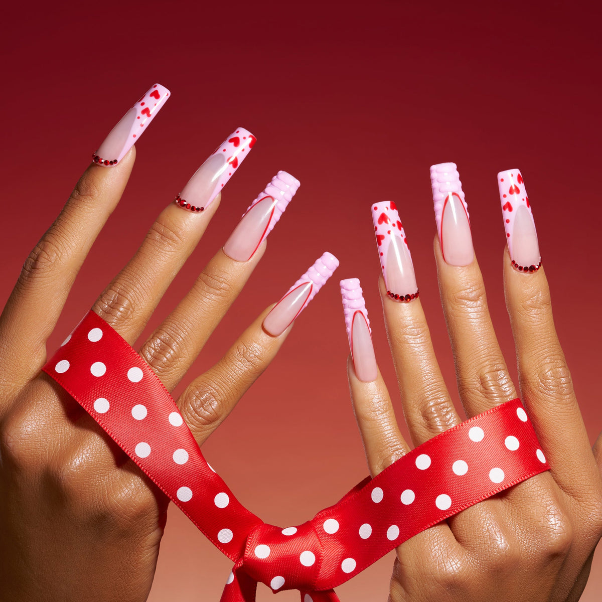 Pink flutter press on nails with heart tips and textured pink 3D edges, long coffin nails, cute valentine style.