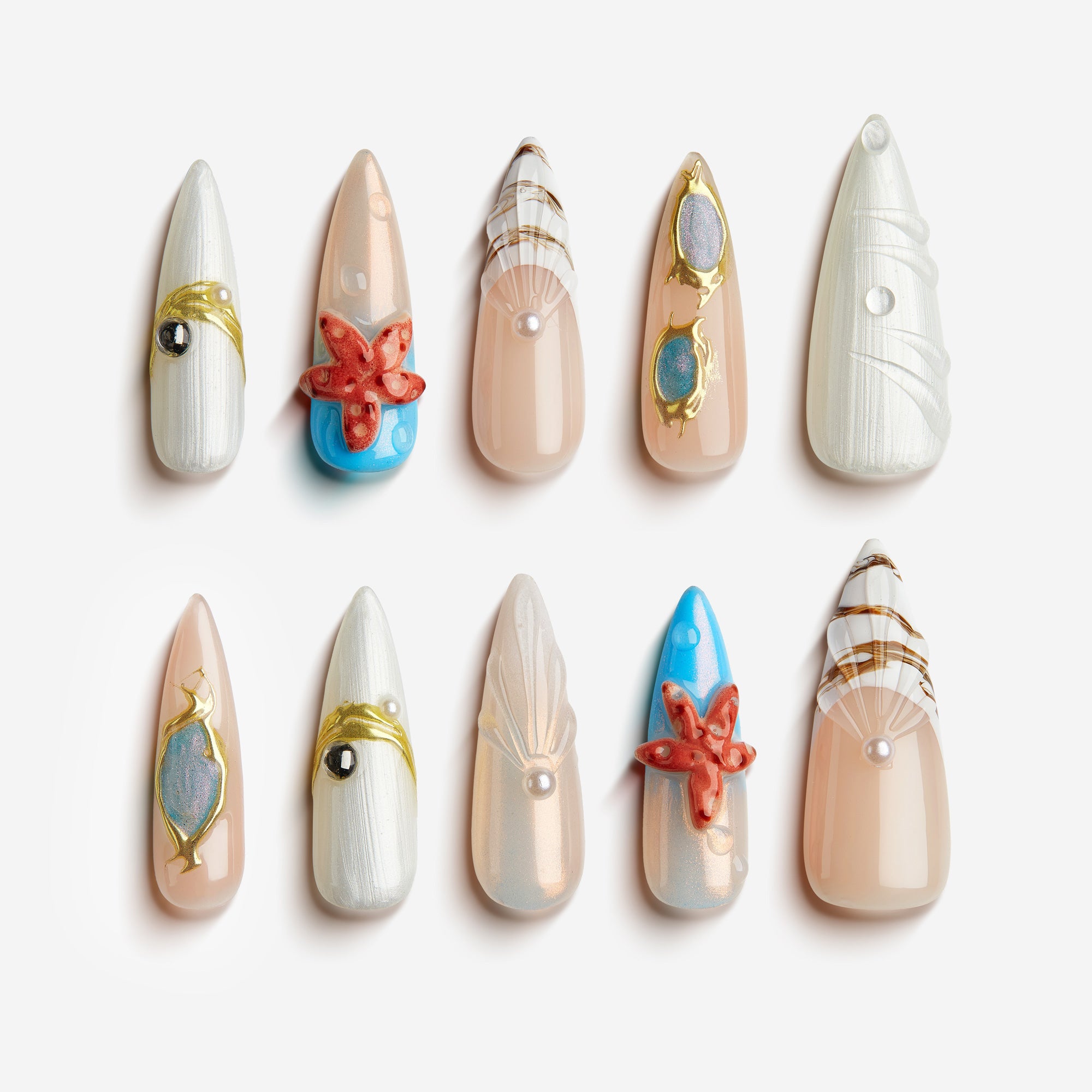 Starfish Pearls | Press-On Nails
Dive into seaside elegance. Featuring pearl-white tones, seashell carvings, golden accents, and 3D starfish designs, Starfish Pearls captures the calm and wonder of the ocean. A luxurious choice for beach vacations, summer looks, or ocean-inspired editorials.