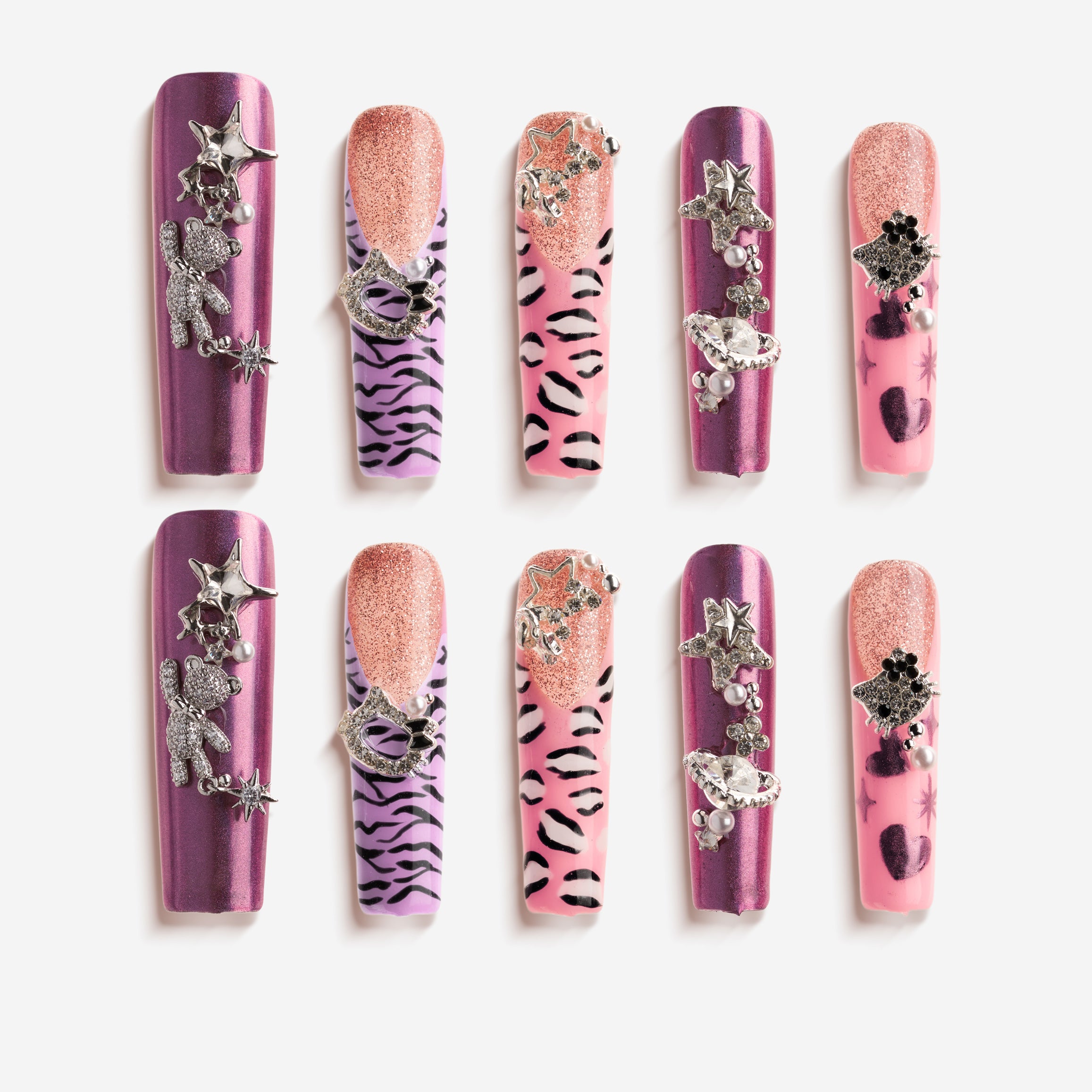 Violet pink crystal press on nails with metallic purple sheen, glitter half-moon design and star/planet charms.