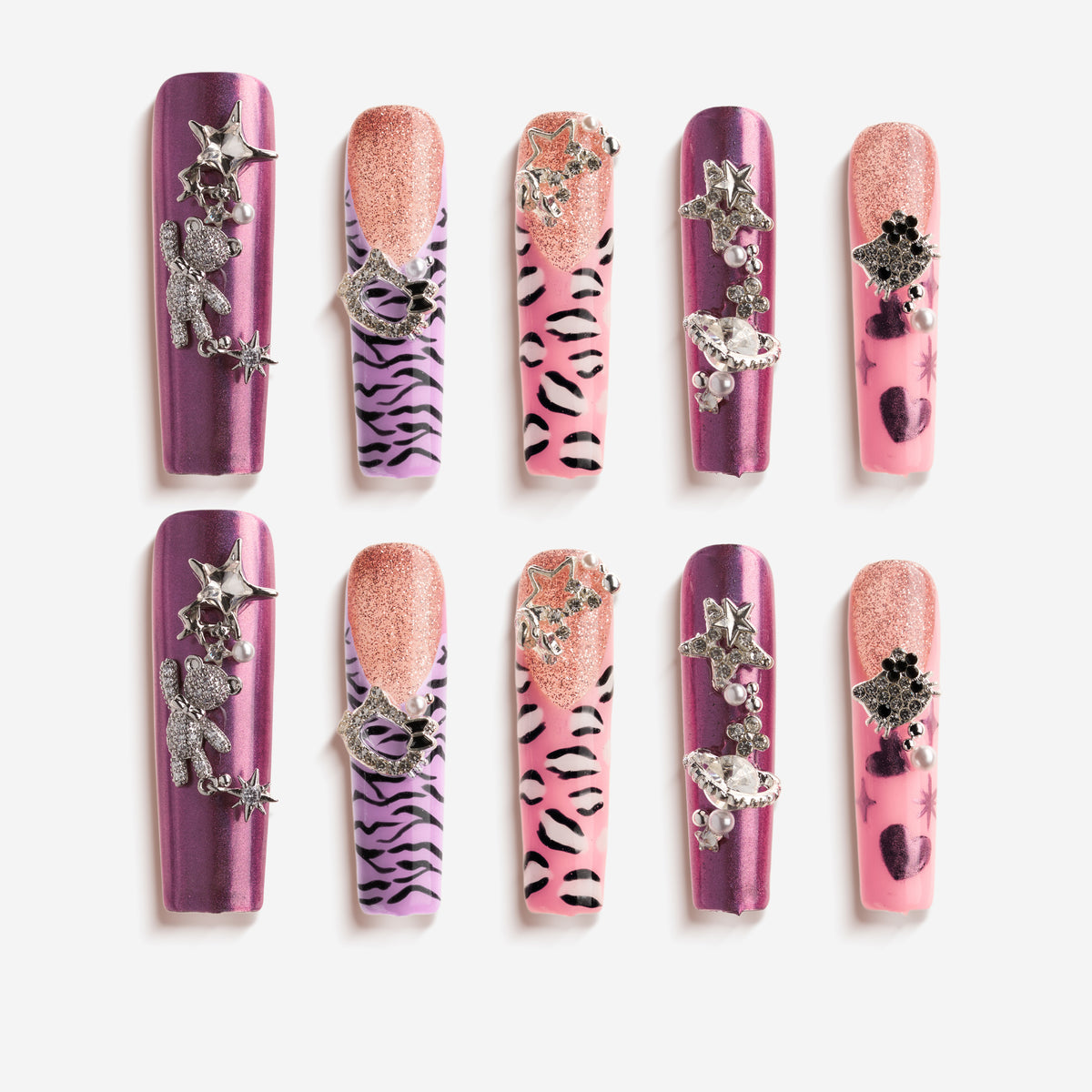 Violet pink crystal press on nails with metallic purple sheen, glitter half-moon design and star/planet charms.