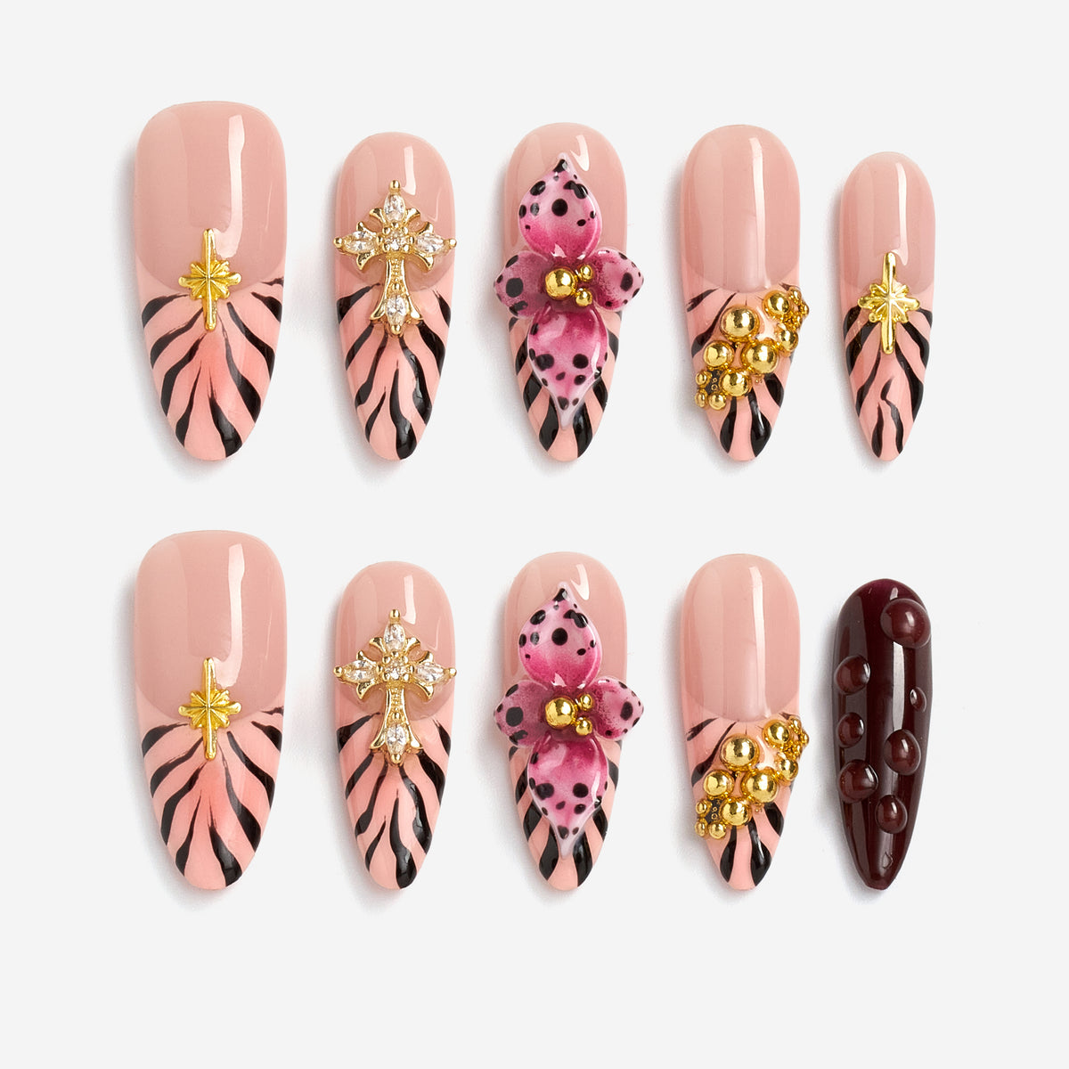 Warm neutral press on nails with gold and crystal details. Handmade reusable nail art set for everyday elegance.