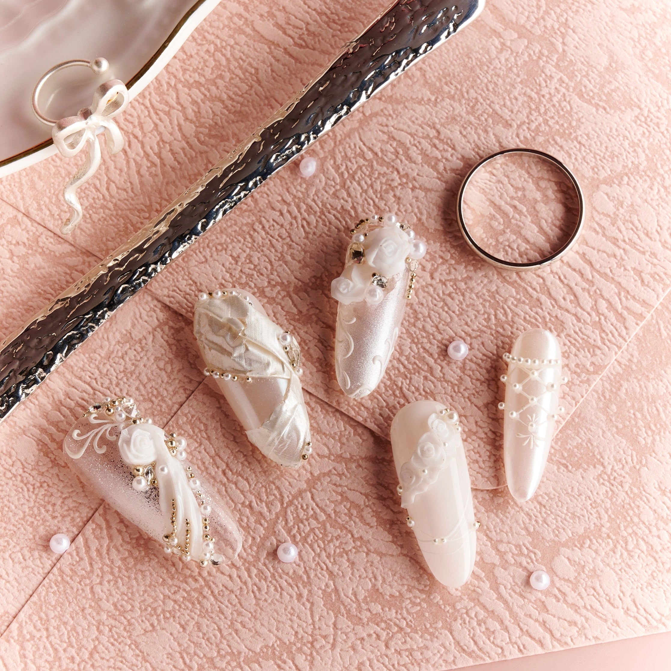 Elegant white wedding press on nails with pearl and crystal accents by BOXNAIL. Timeless bridal manicure for ceremonies and receptions.