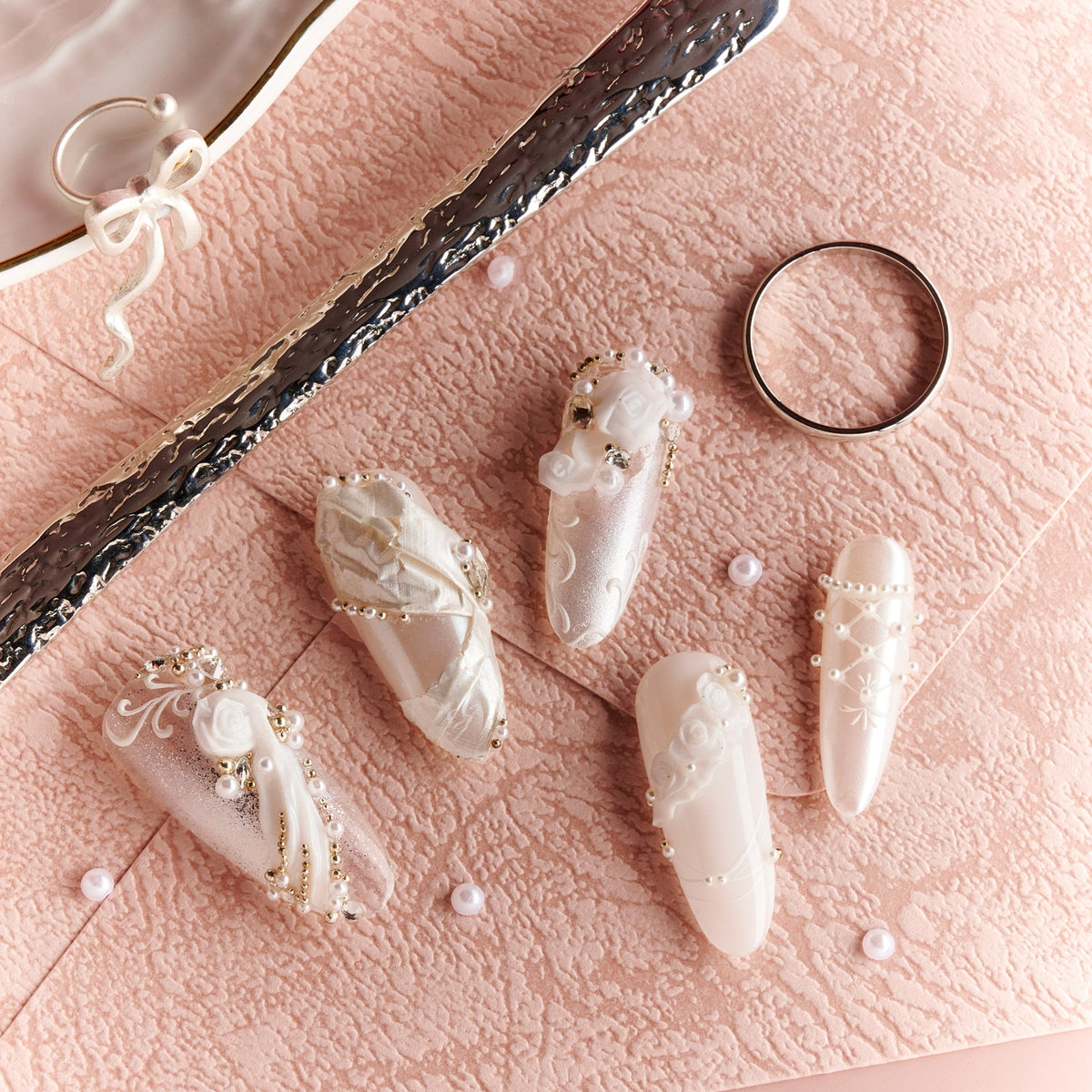 Elegant white wedding press on nails with pearl and crystal accents by BOXNAIL. Timeless bridal manicure for ceremonies and receptions.